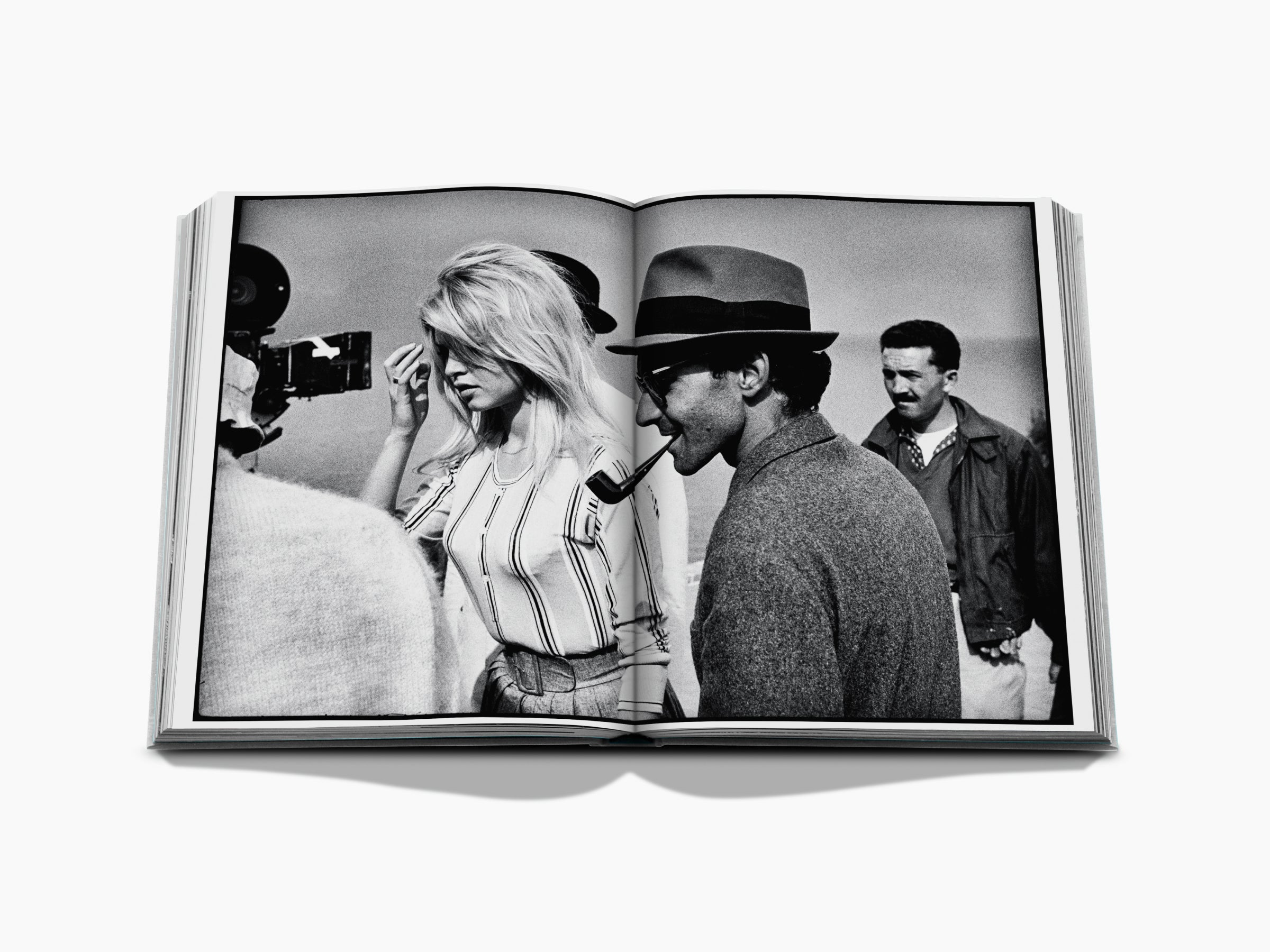Open book spread displaying a collage of black and white and color photographs.