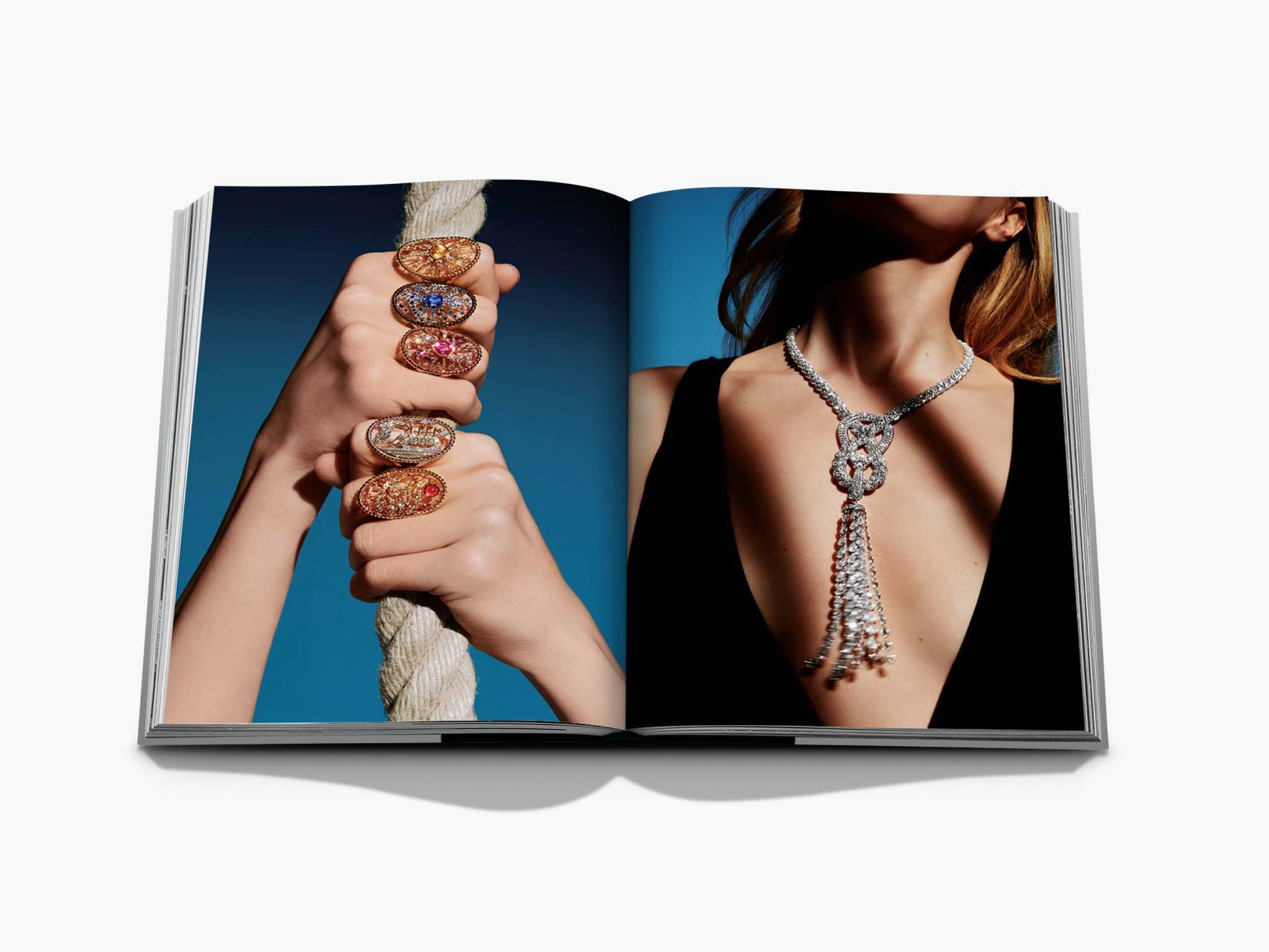 Chanel 3 book slipcase spread featuring stacked jeweled rings on a rope and a diamond tassel necklace