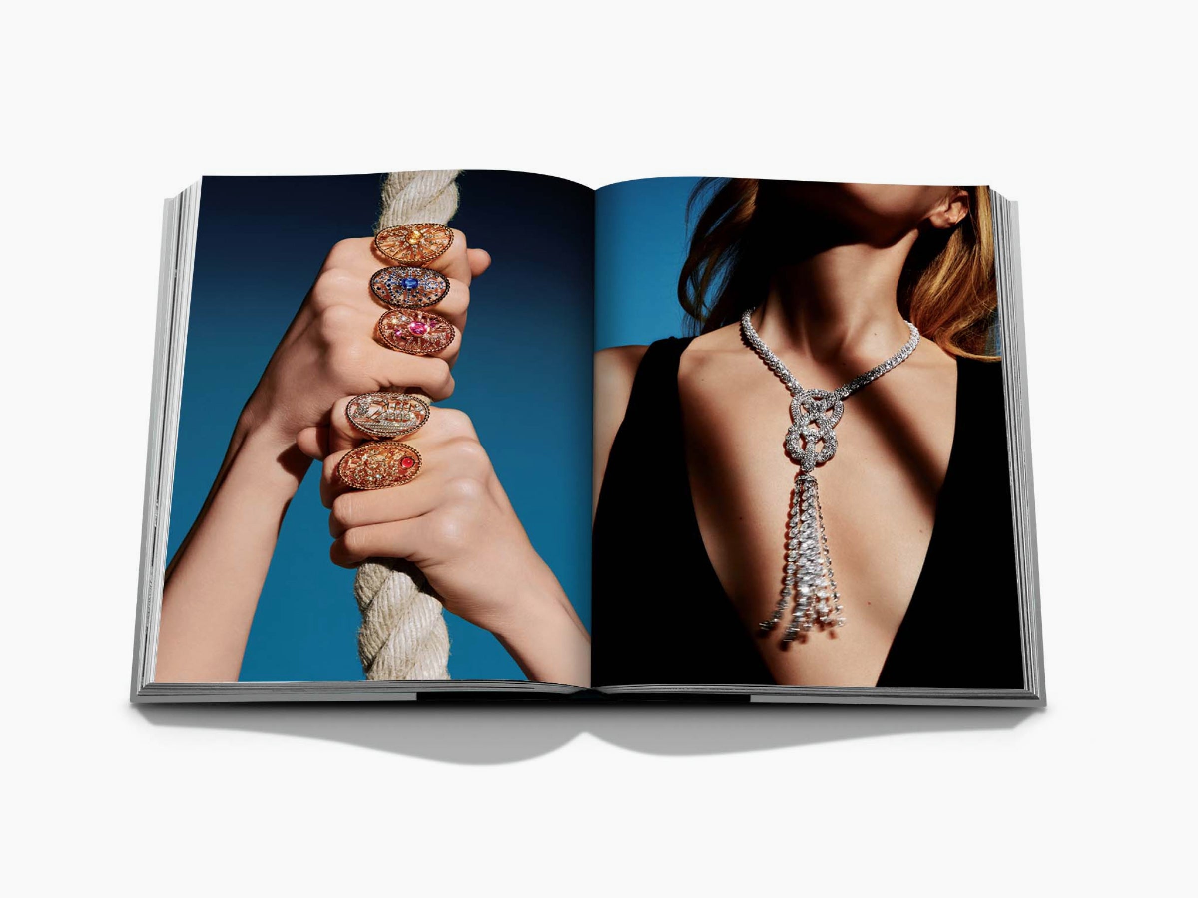 Chanel 3 book slipcase spread featuring stacked jeweled rings on a rope and a diamond tassel necklace