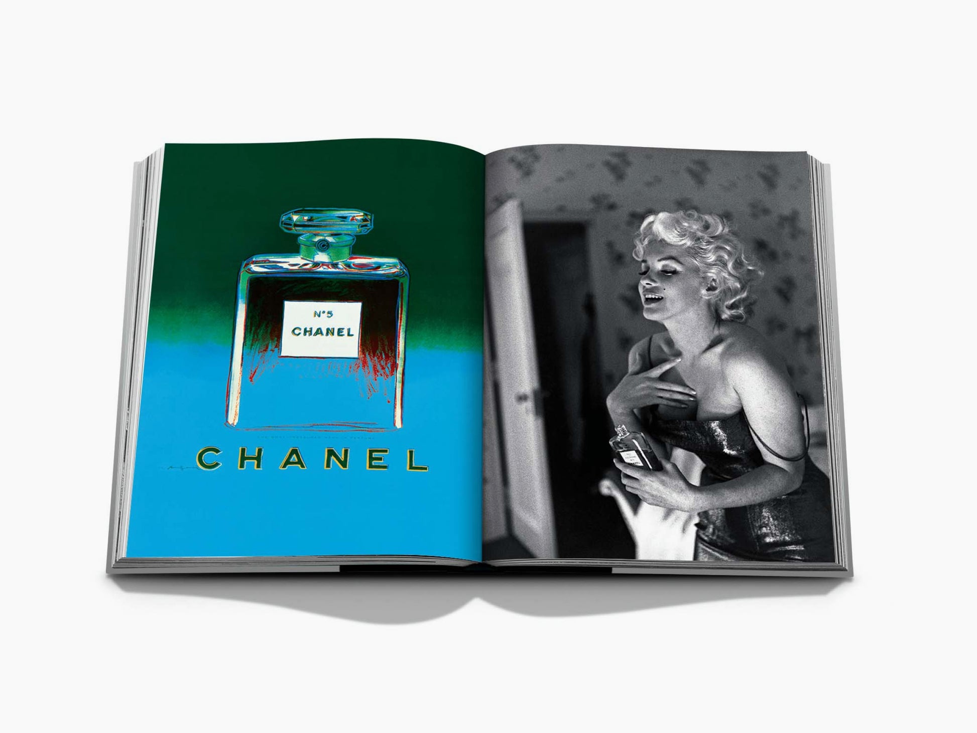 Colorful Chanel No 5 bottle illustration on the left page of an open Assouline Chanel book