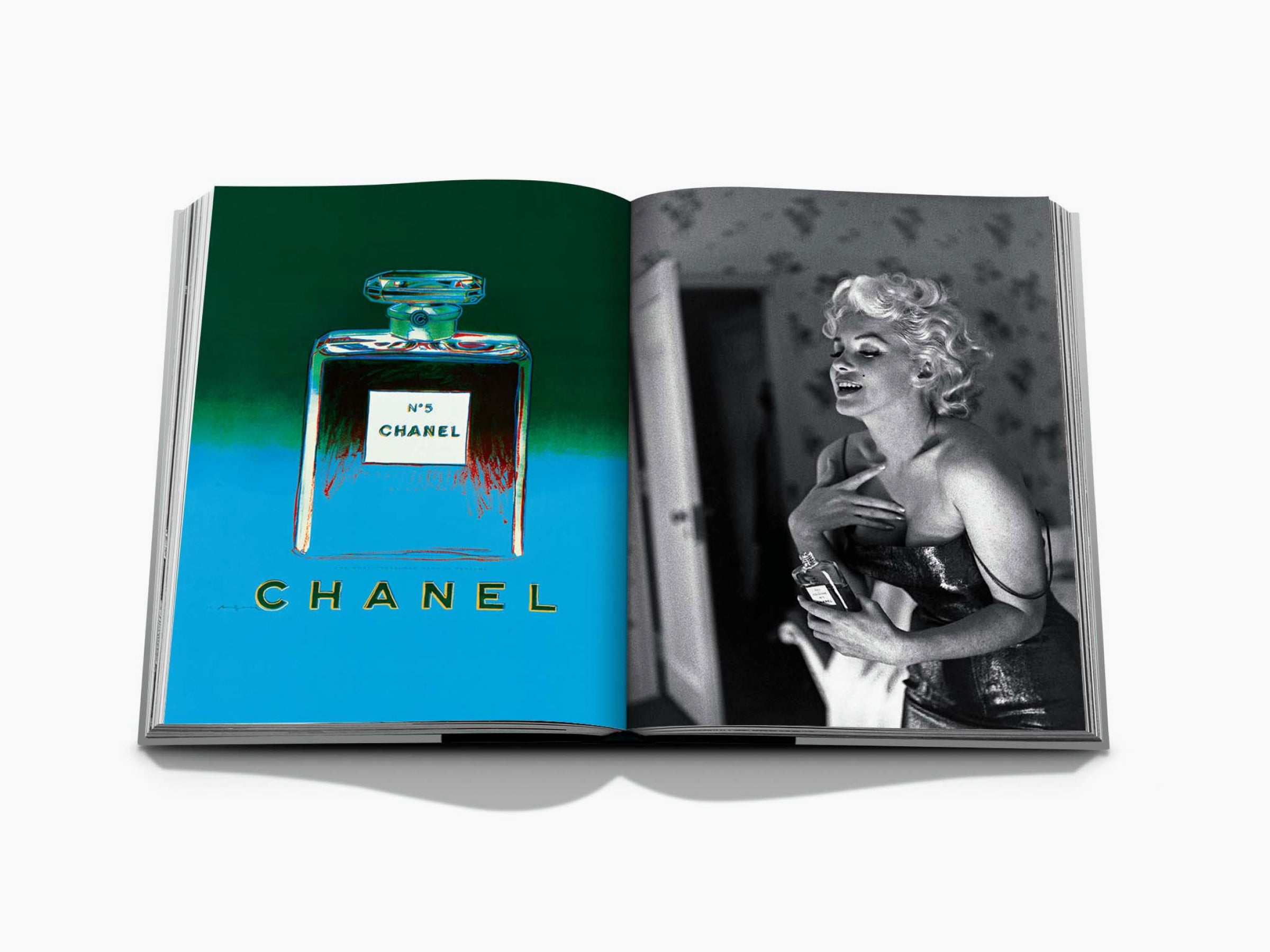 Colorful Chanel No 5 bottle illustration on the left page of an open Assouline Chanel book