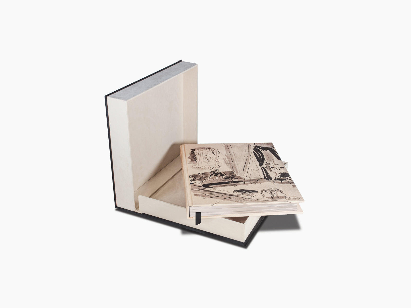 Open Chanel book displayed with a cream presentation box behind it, showing the Introduction page and a storefront photograph