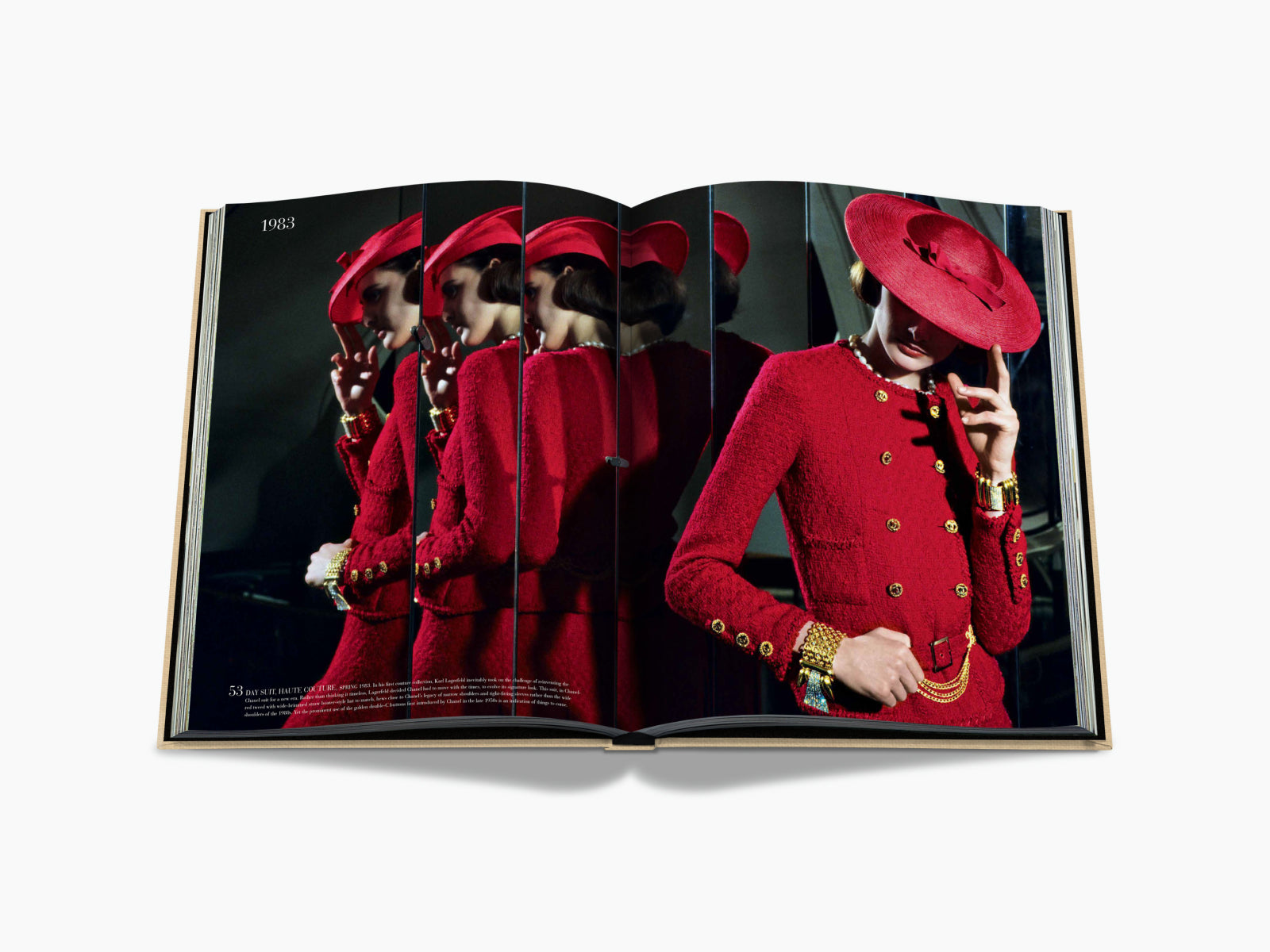 Chanel red quilted suit with gold buttons and matching wide hat reflected in mirror panels