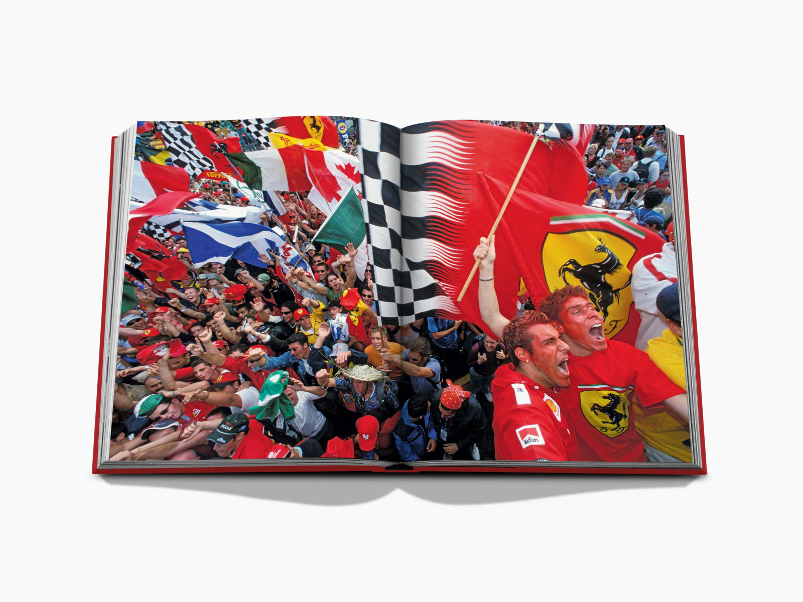 Open book spread featuring a packed crowd of Formula 1 fans with flags spanning across both pages