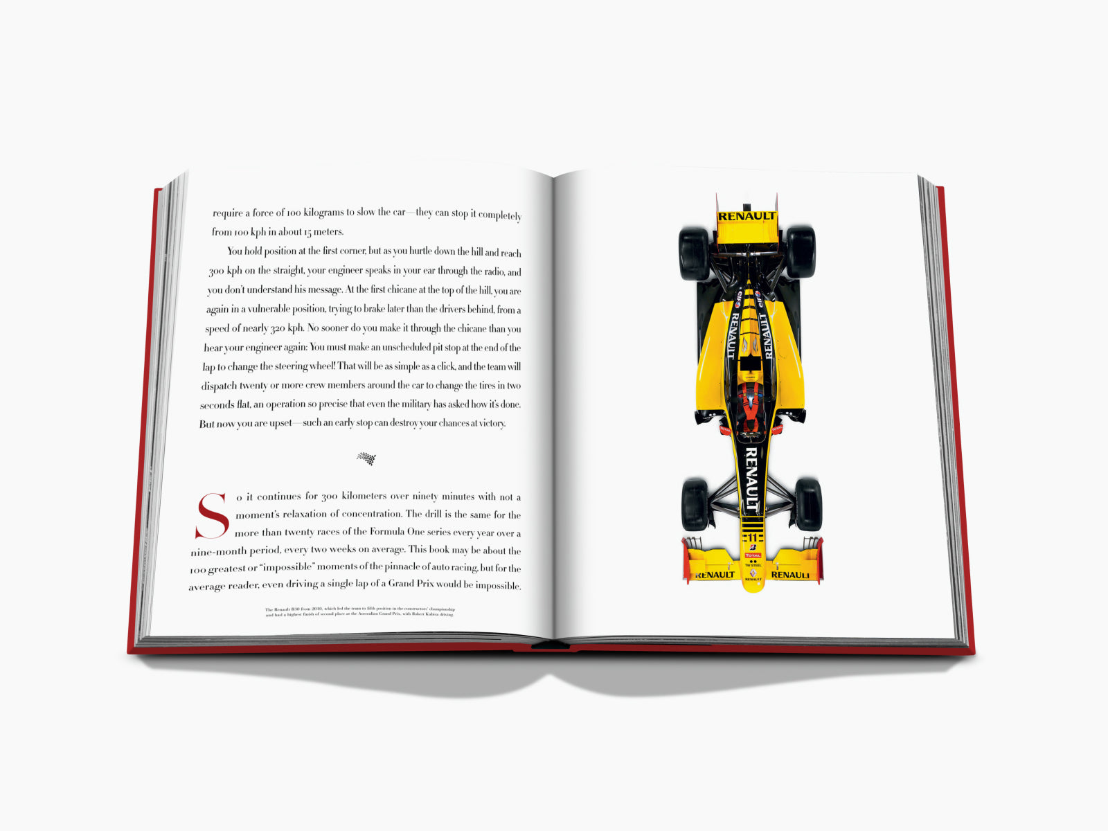 Open book spread with a yellow Renault Formula 1 car illustration on the right page and text on the left