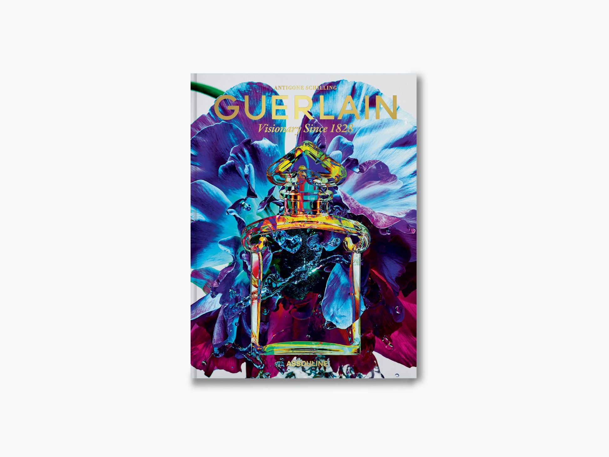 Guerlain Visionary Since 1828 book cover with a colorful perfume bottle set against vivid blue and purple petals.
