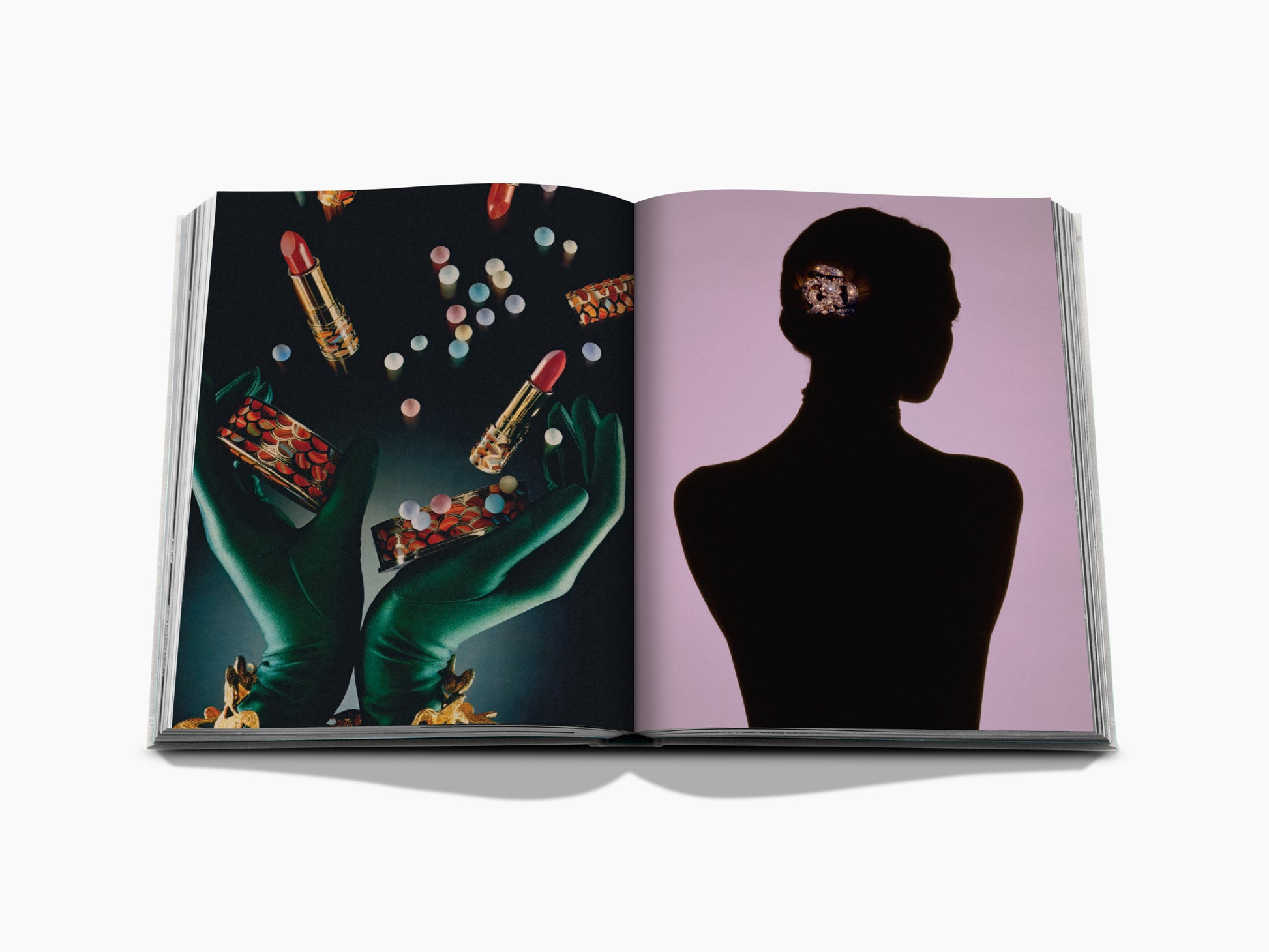 Opened Guerlain VisionarySince 1828 book spread with makeup items and green gloves on the left and a silhouette portrait against a pink background on the right.