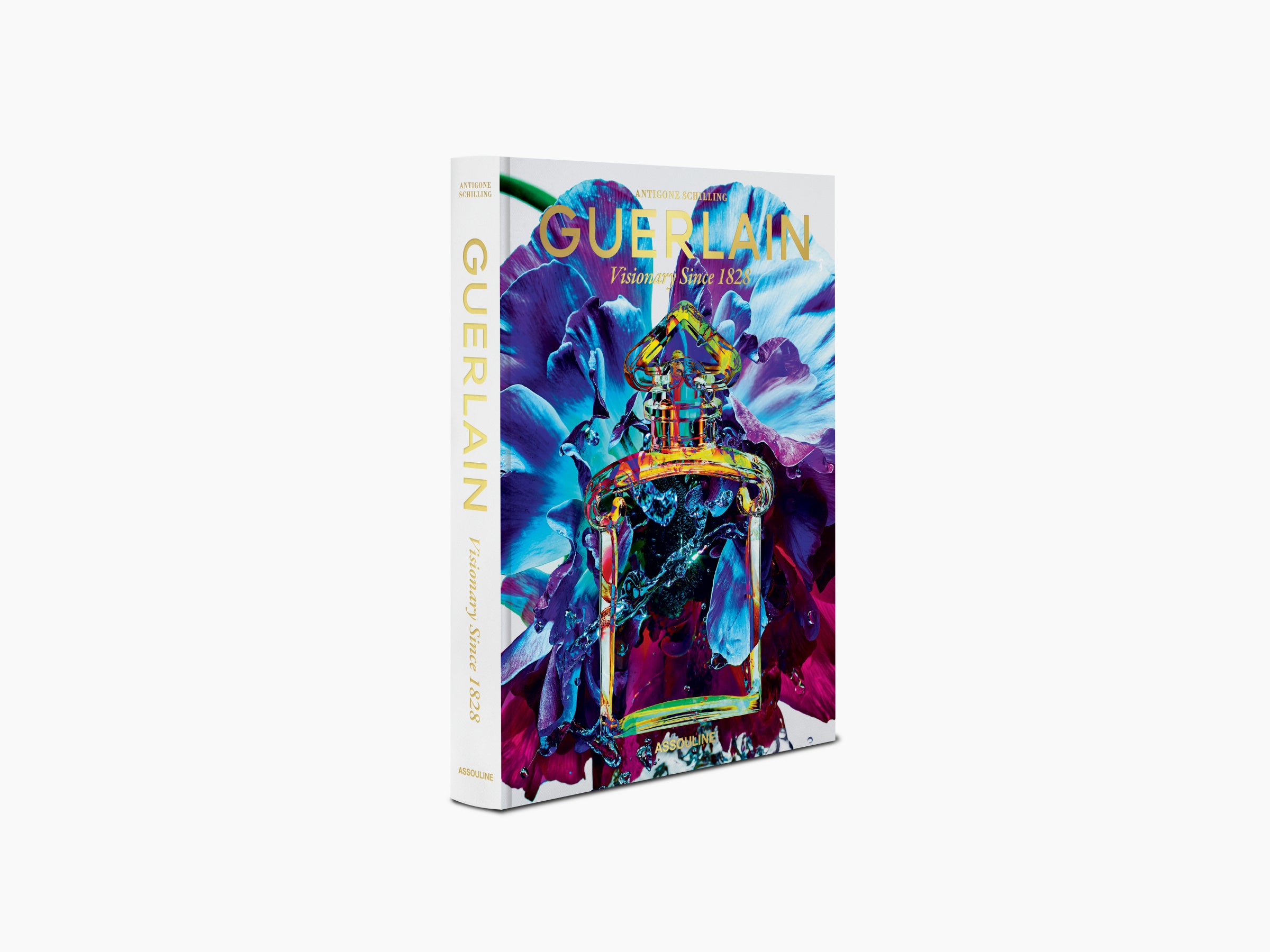 Guerlain Visionary Since 1828 book standing upright with colorful bottle artwork on a light background.