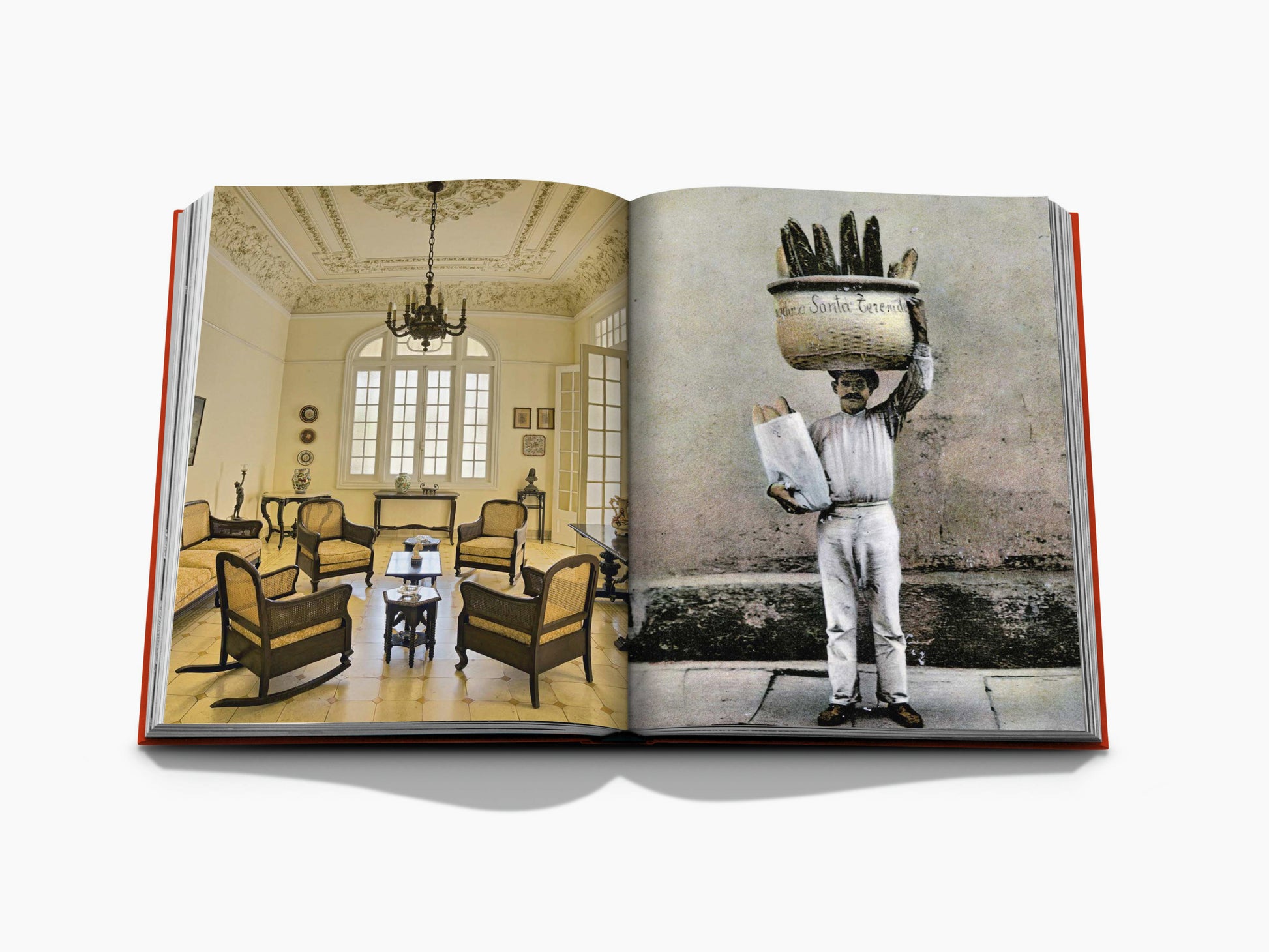 Open book spread showing a vintage elegant living room on the left and a man balancing a basket on his head on the right.