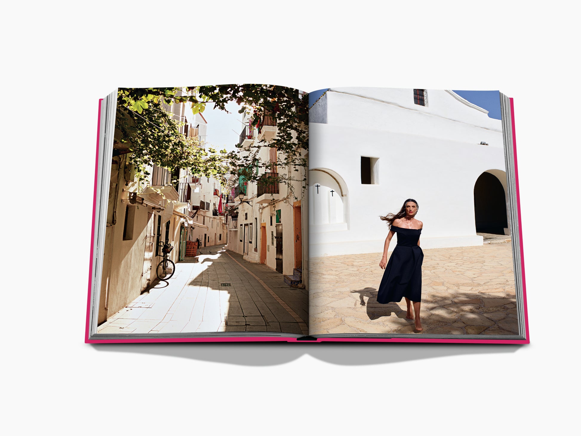 Open book spread featuring a sunlit Mediterranean alley on the left and a woman in an off shoulder navy dress against a white building on the right.