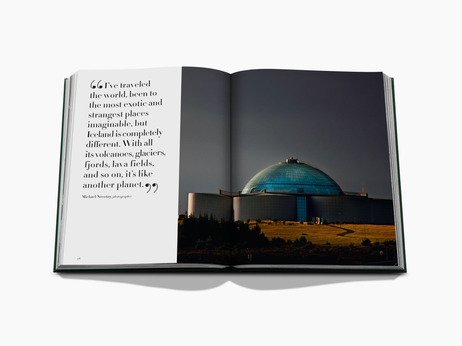 Open Iceland travel book spread with a quote on the left and a glass-domed modern building on the right.