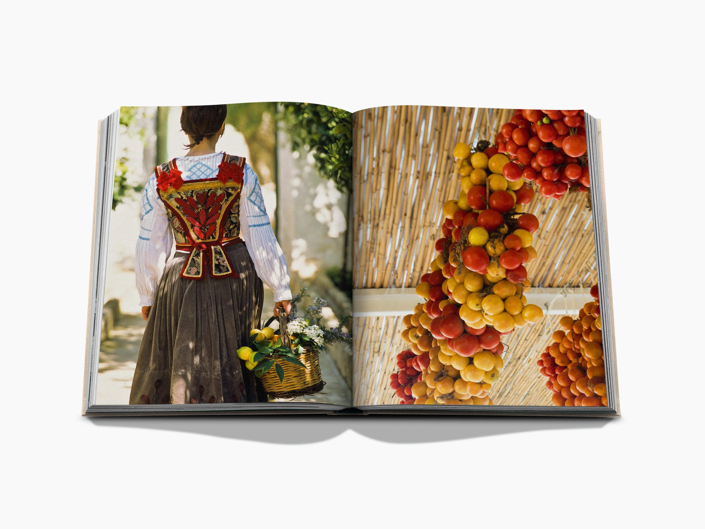 Open two-page spread featuring a woman in traditional dress with a basket on the left and hanging tomatoes on the right.