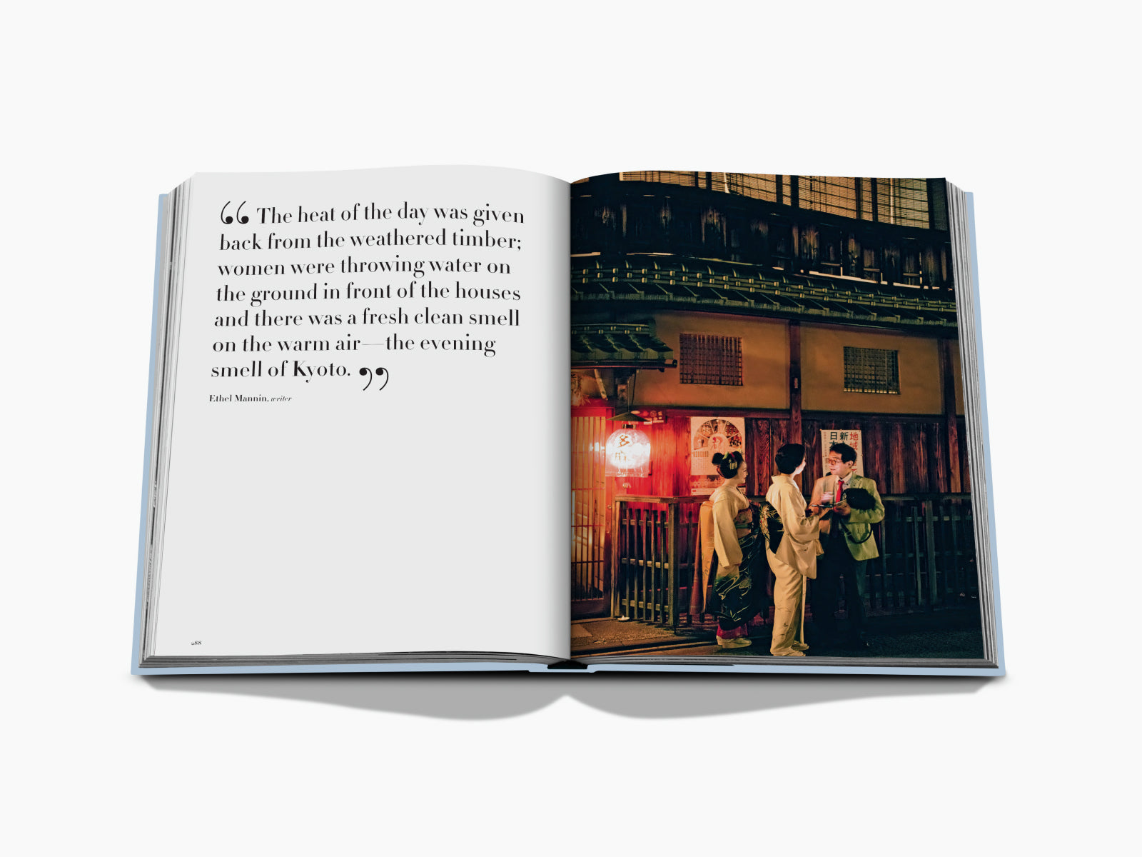 Kyoto Serenity open book spread showing a neon Kyoto street scene on the right and a quote on the left.