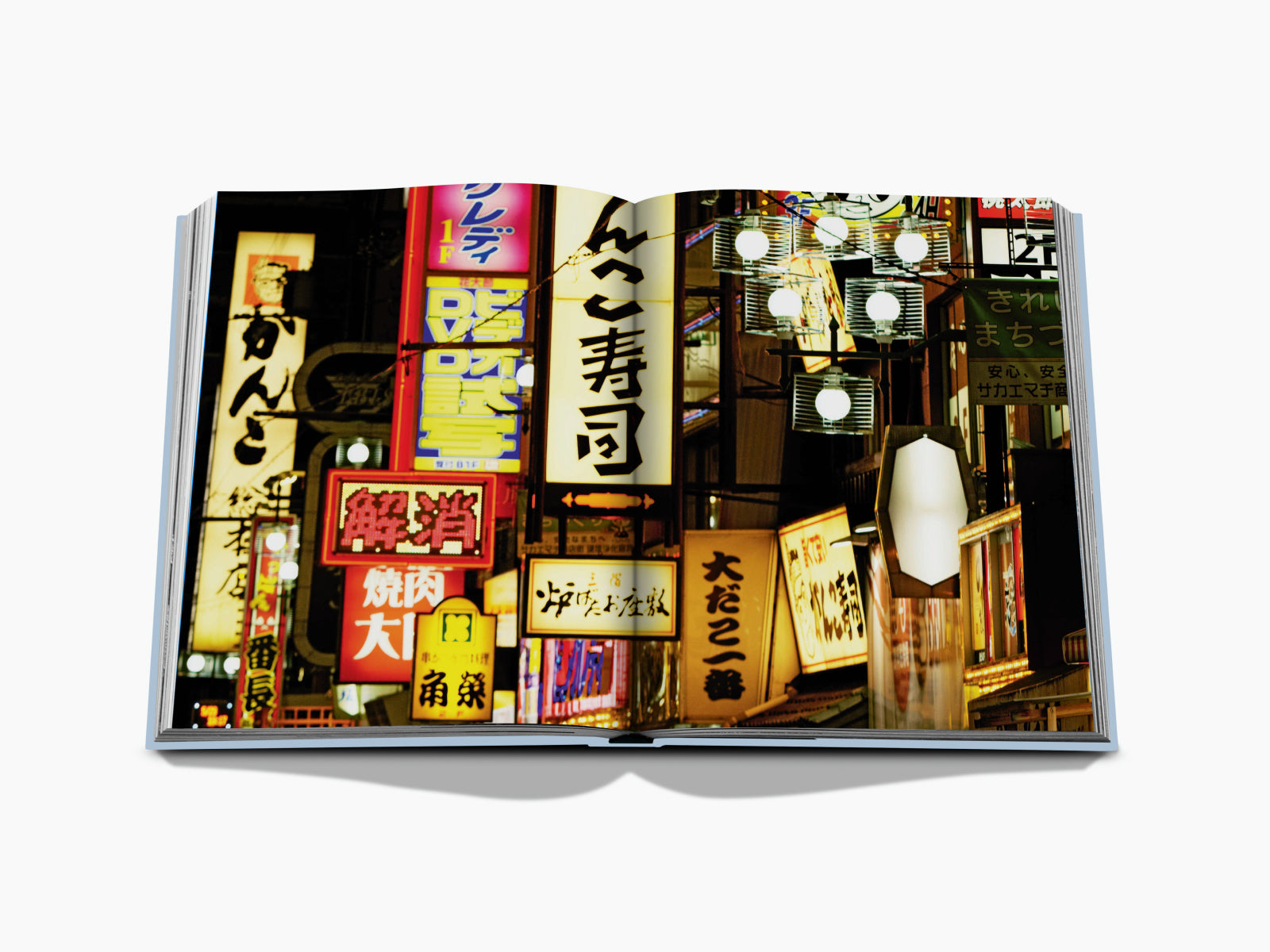 Kyoto Serenity open book spread with illuminated signboards on the right and a text page on the left.