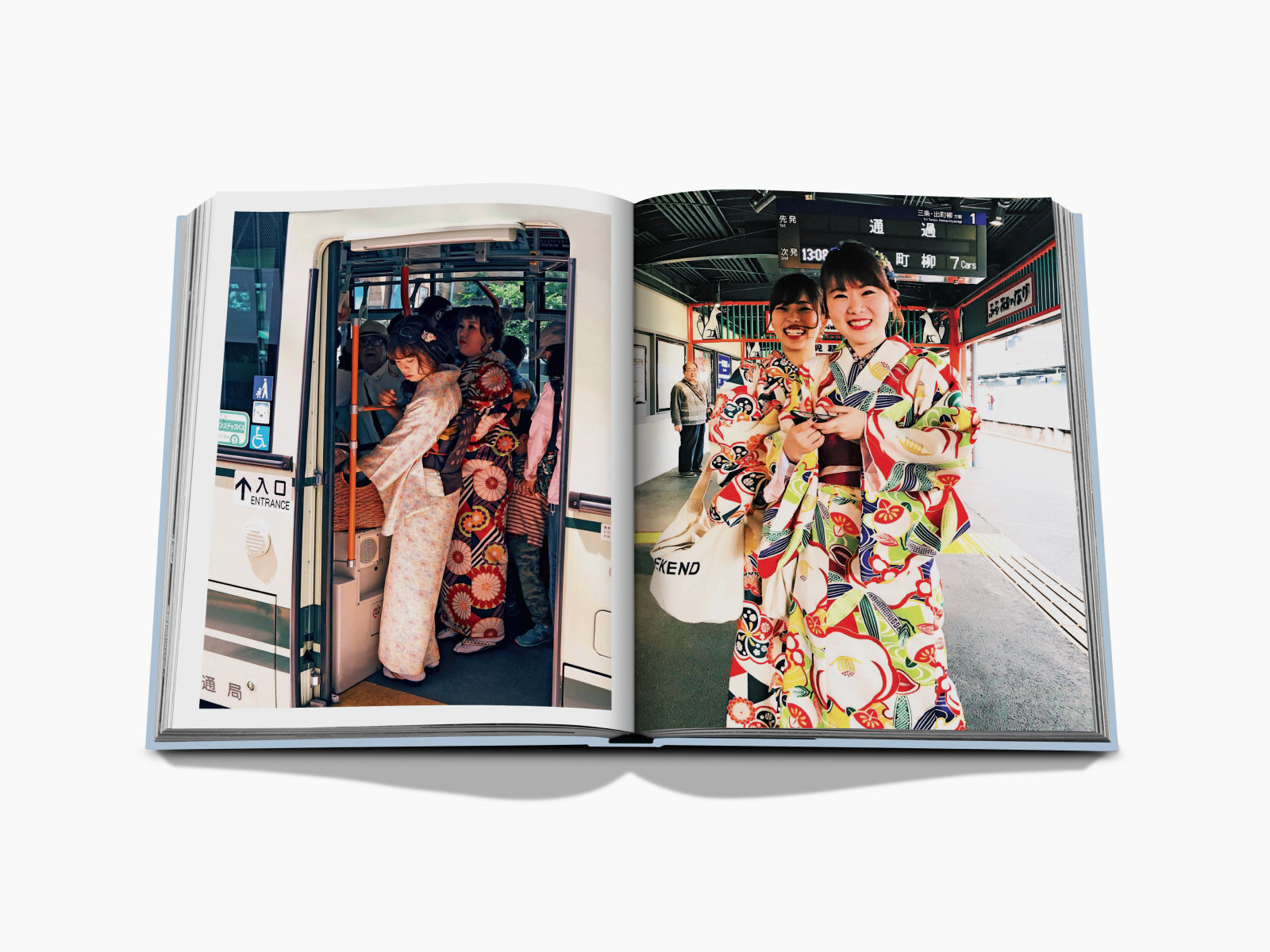 People in colorful kimonos boarding a Japanese train at the station