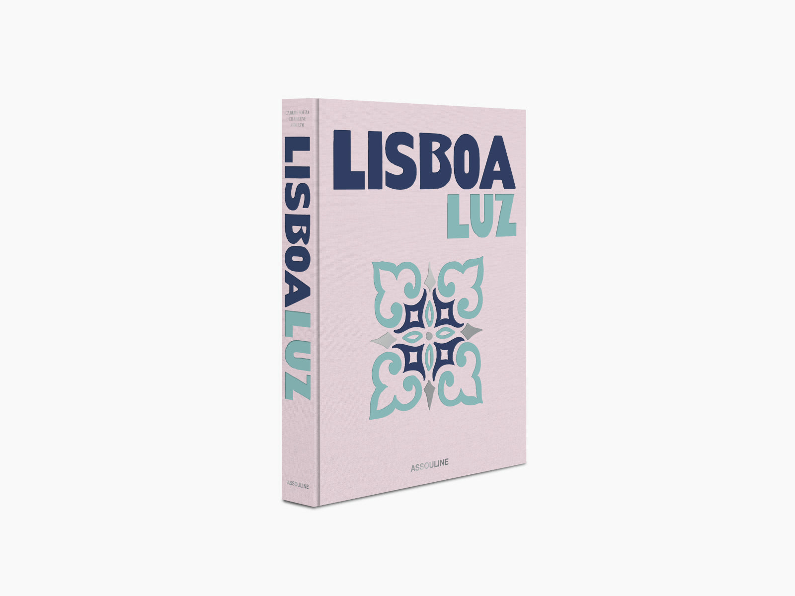 Side view of Lisboa Luz hardcover with pink cover and bold navy Lisboa along the spine.