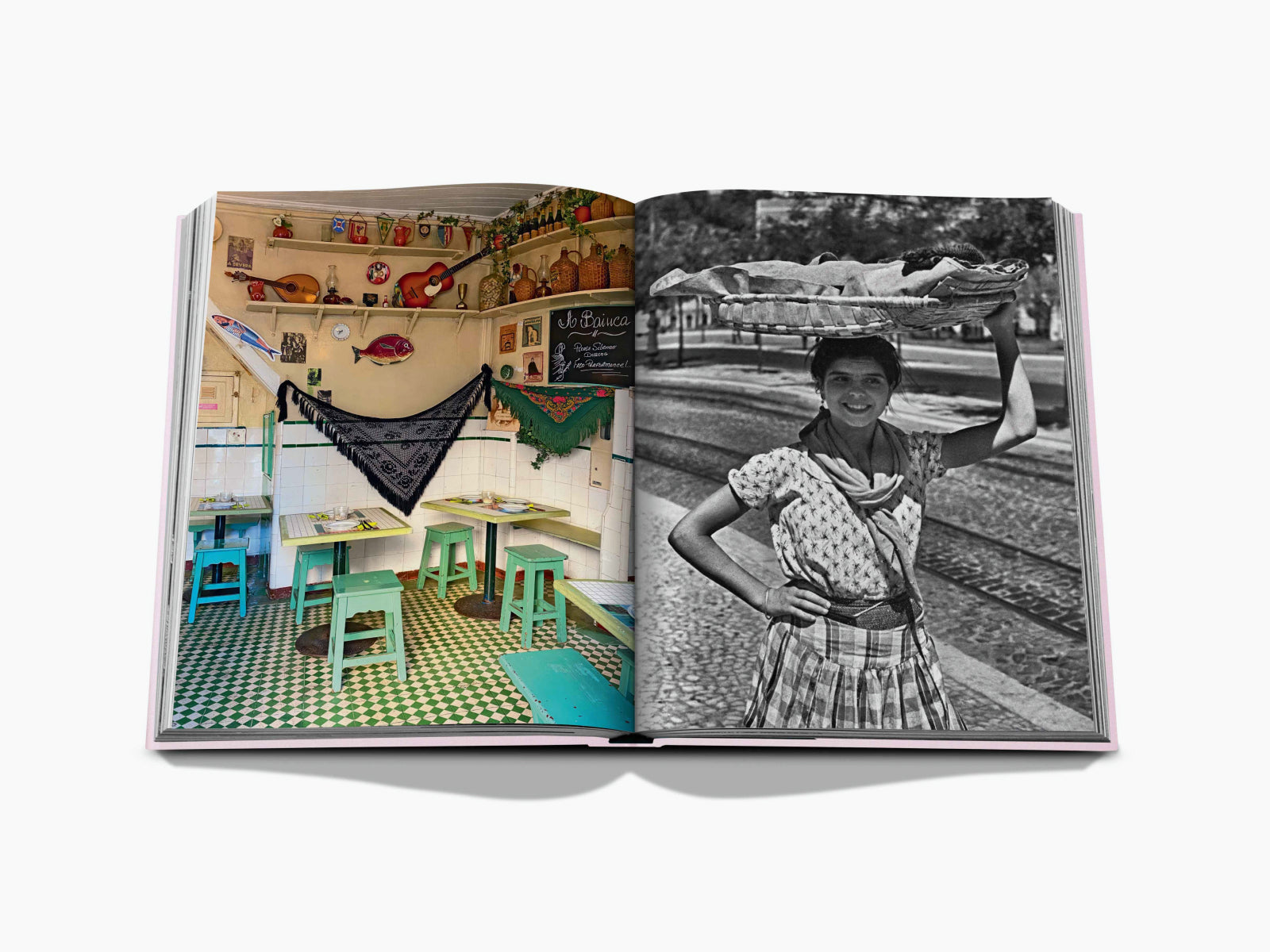 Left page colorful shop interior with guitars and ornaments, right page a smiling woman with a basket on her head by railroad tracks.