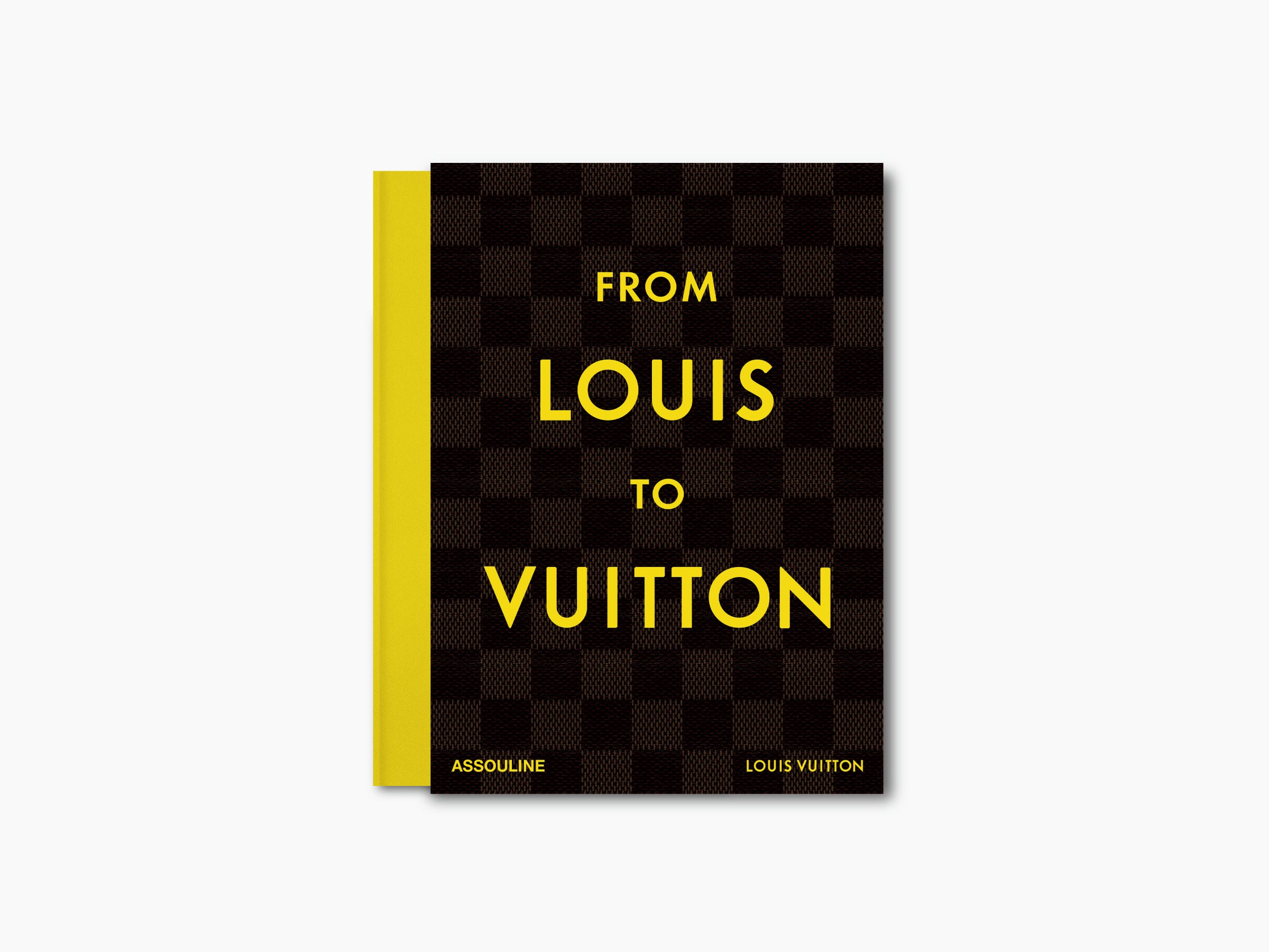 From Louis to Vuitton book with a dark checkered cover and bright yellow spine