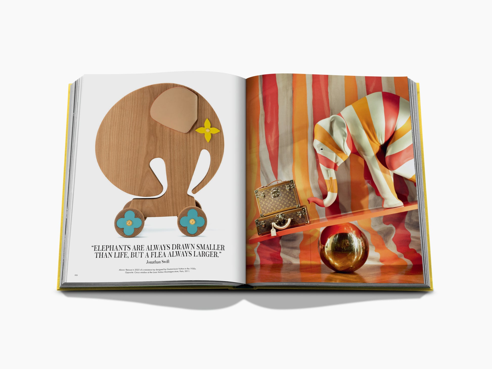 Open From Louis to Vuitton with a yellow-edged cover; left page shows a wooden elephant, right page a striped colorful backdrop with a handbag.