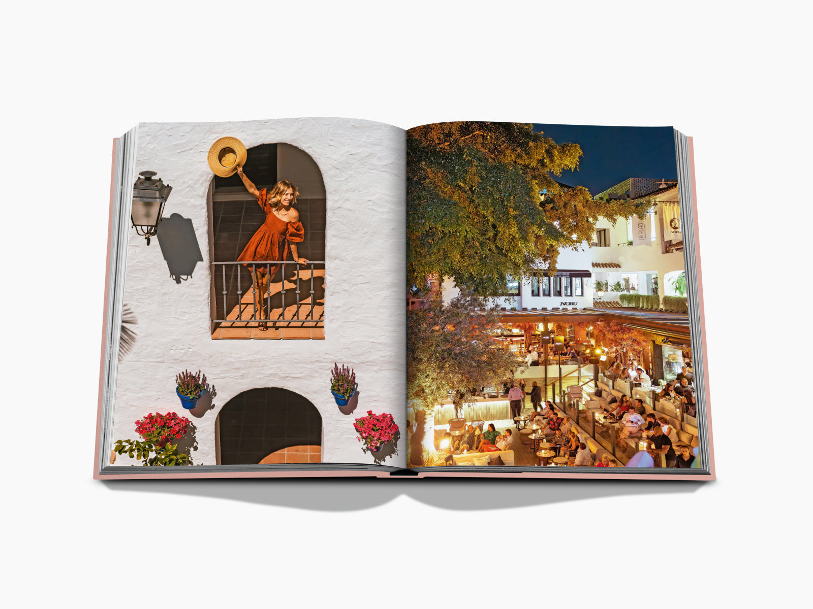 Orange dress woman on a white arch wall raises a hat while a bustling Marbella bar scene glows in the evening.