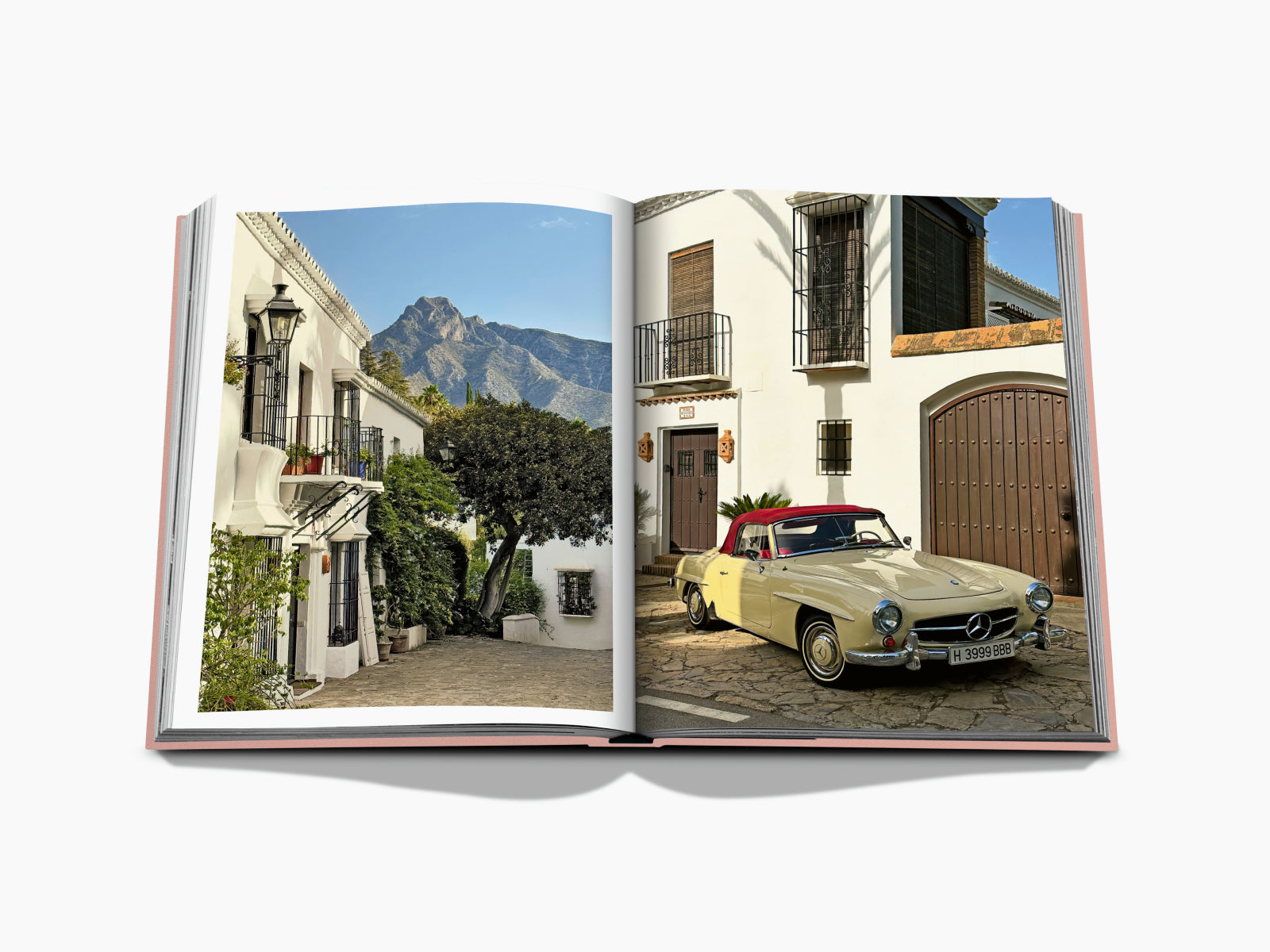 Marbella Sol open book spread featuring a sunlit white Mediterranean street on the left and a cream vintage Mercedes convertible parked in front of a doorway on the right
