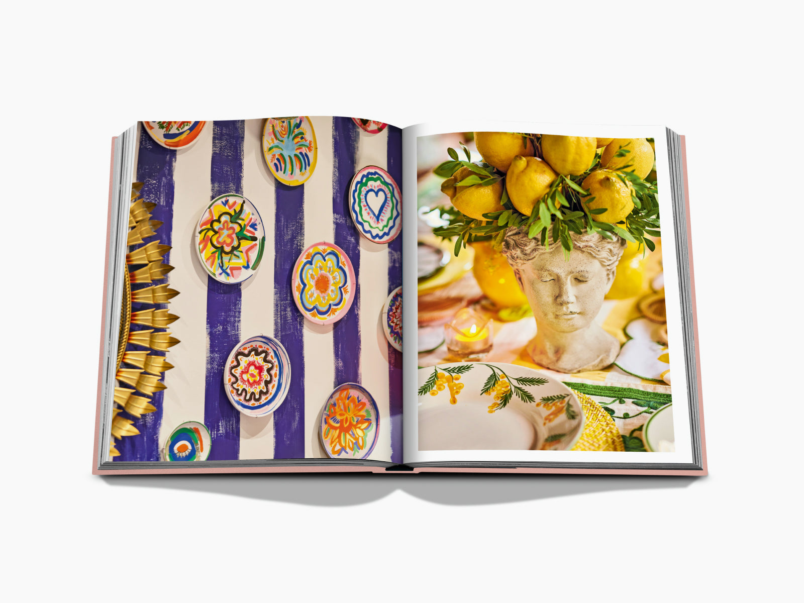 Colorful hand painted ceramic plates mounted on a blue and white striped backdrop in a Marbella Sol spread