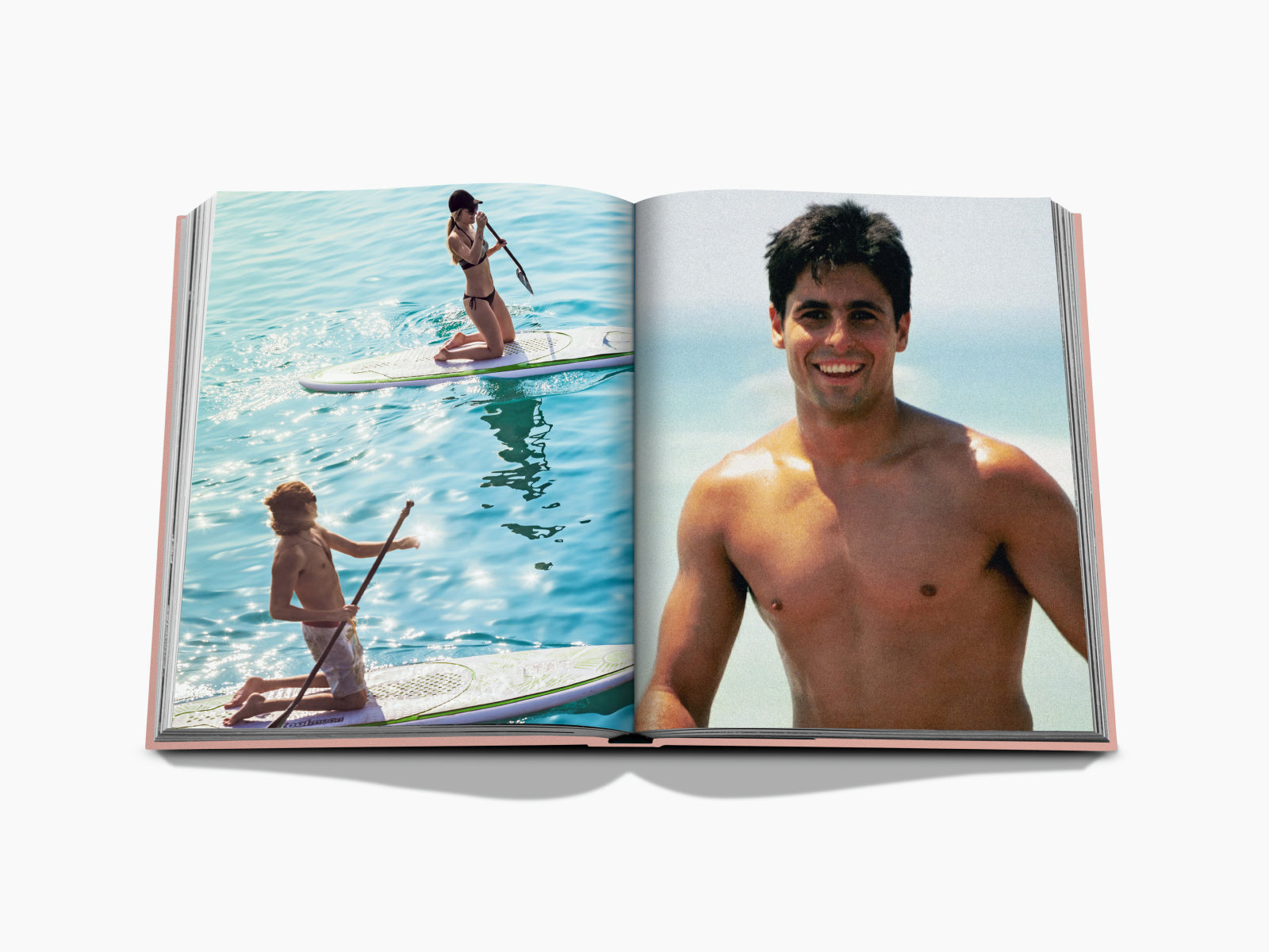 Marbella Sol open book spread with a woman paddleboarding in turquoise water on the left and a smiling shirtless man against a beach backdrop on the right