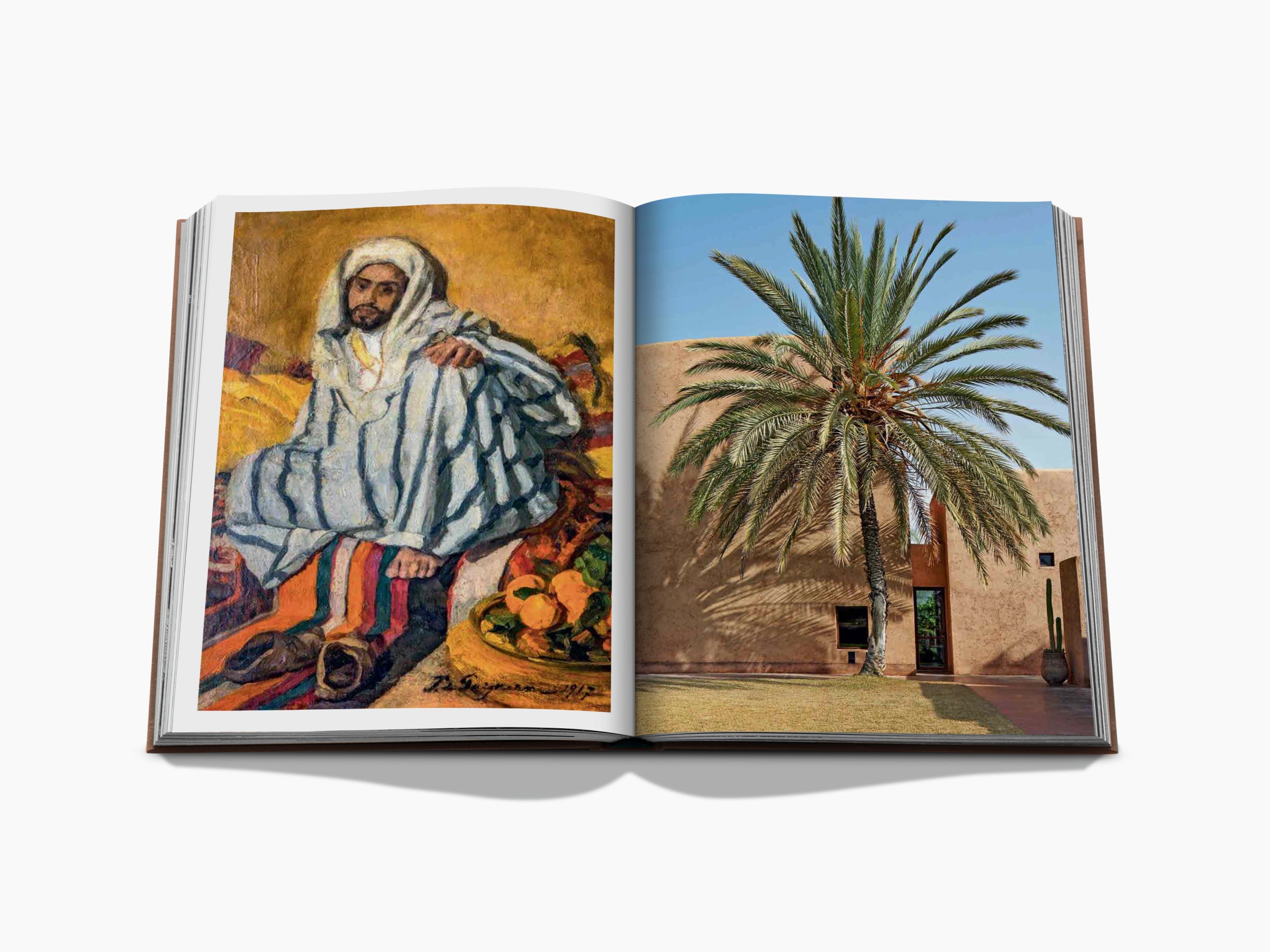 Marrakech Flair spread showing a robed figure painting on the left and a blue adobe villa with a palm tree on the right