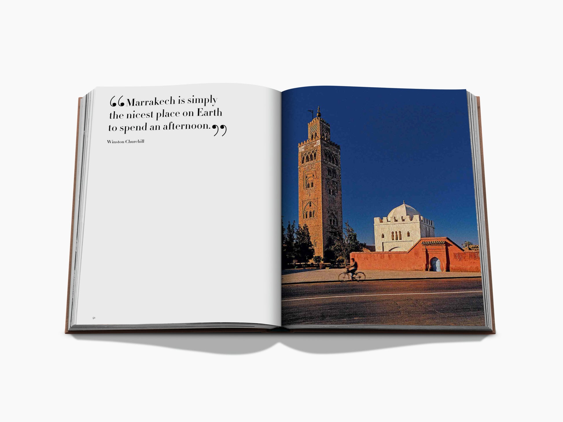 Open Marrakech Flair spread showing a Winston Churchill quote on the left and a cityscape with a tall tower and red walls on the right.