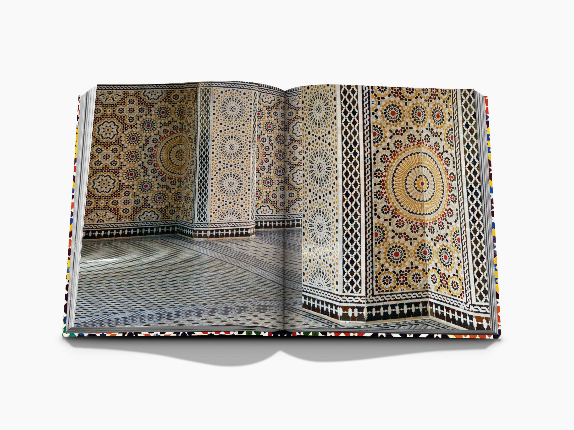 Open spread from Moroccan Decorative Arts showing intricate mosaic tilework on walls and floor across two pages.