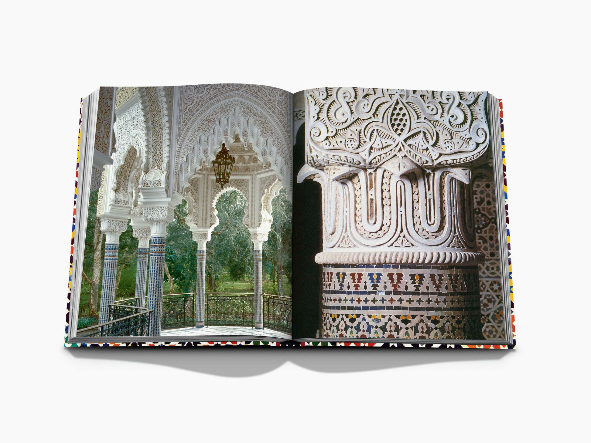 Intricately carved Moorish arches and columns with detailed tilework.
