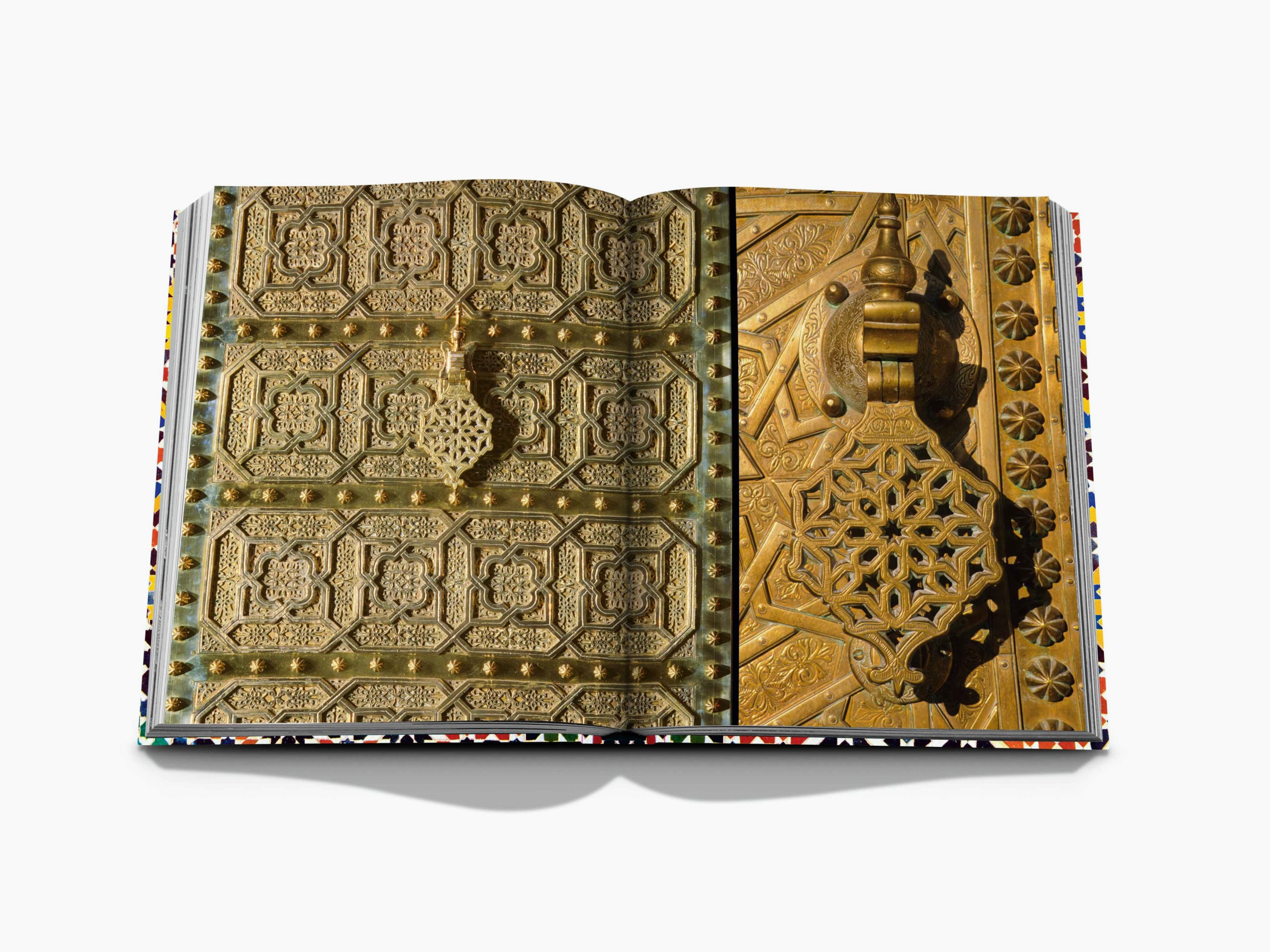 Two-page spread of ornate gold metalwork with geometric patterns and a decorative latch.