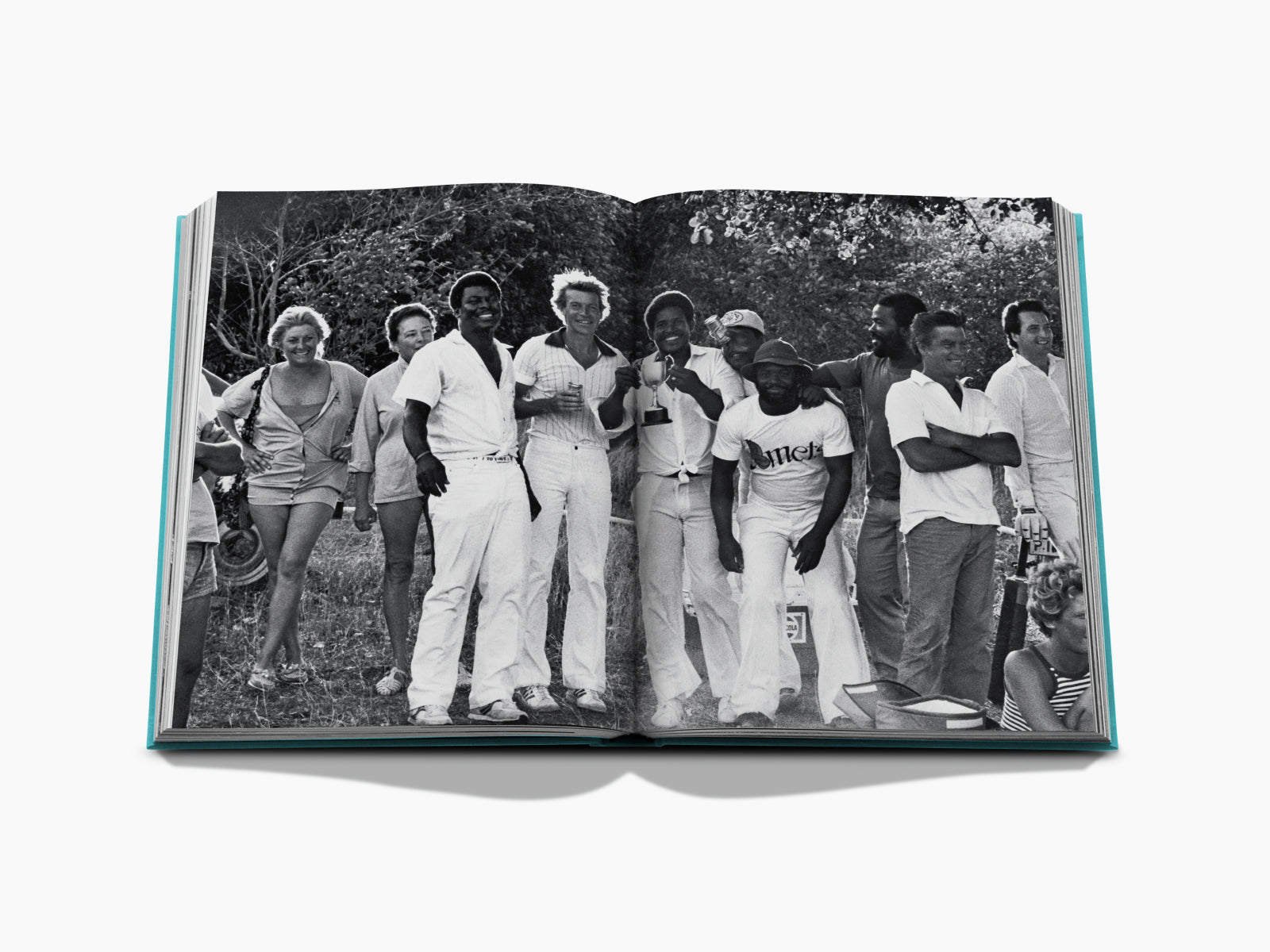 Black-and-white photo from Mustique Icon showing a diverse group of friends posing outdoors.