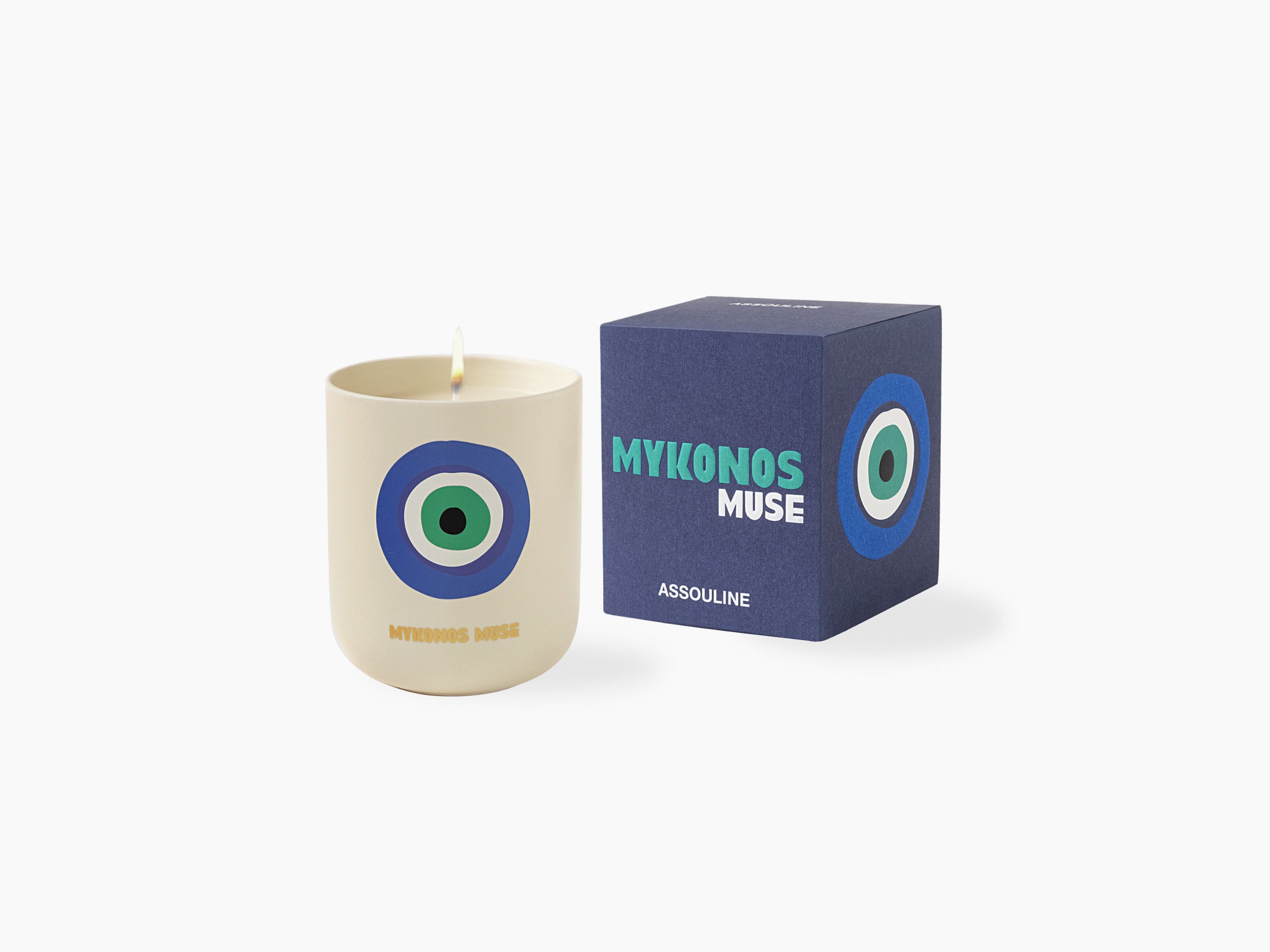 Cream Mykonos Muse scented candle with a blue green circular eye logo beside the navy Mykonos Muse box on a white background
