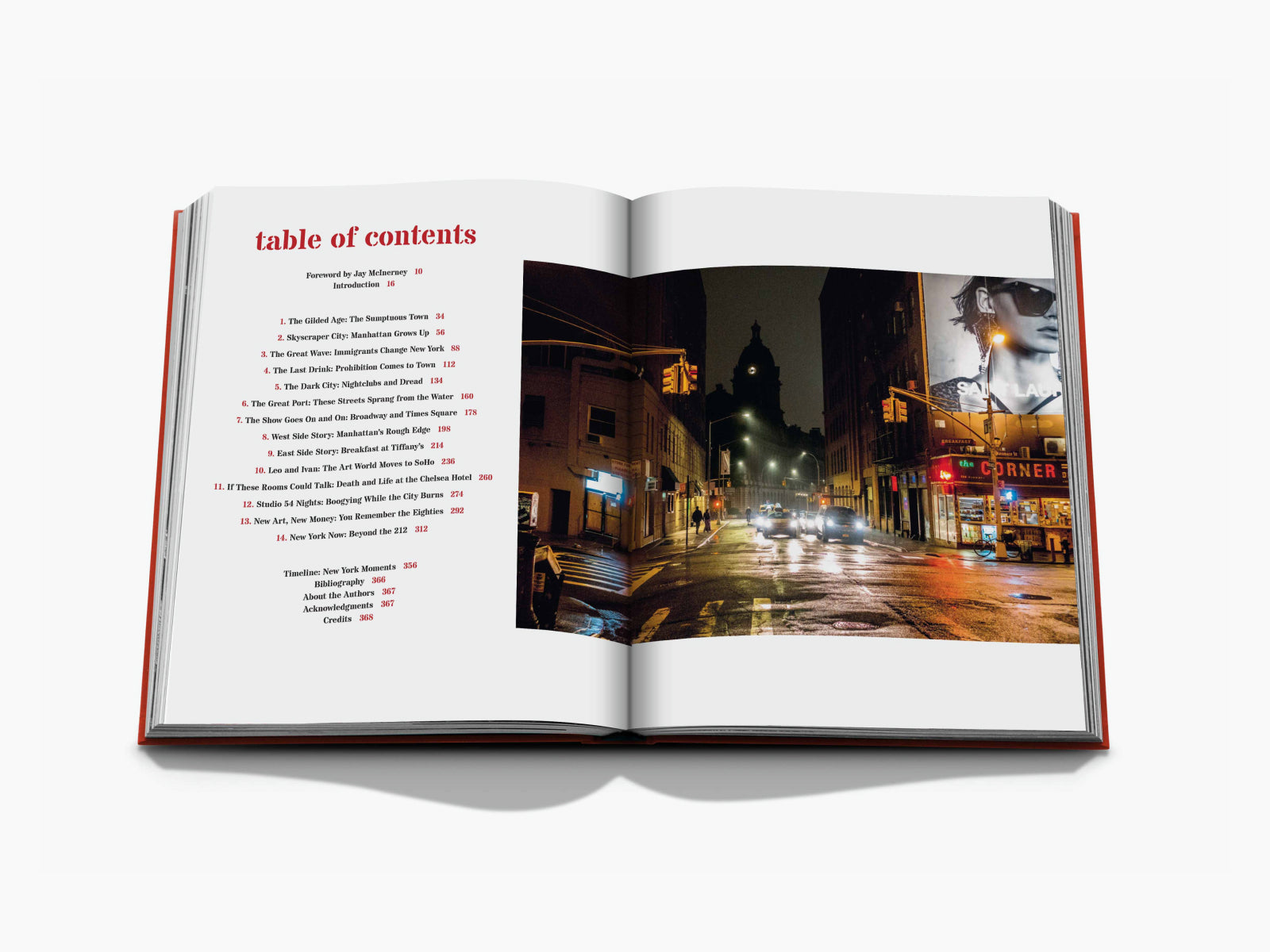 Open book with a table of contents on the left and a night city street photograph on the right