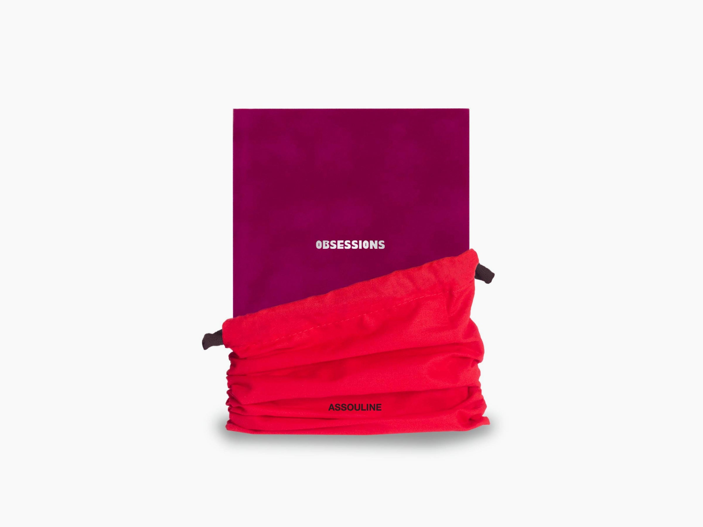 Obsessions notebook with a bright magenta cover partially wrapped by a red fabric pouch