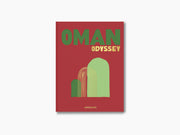 Red Oman Odyssey hardcover with bold green Oman and yellow Odyssey and an arched graphic on the cover