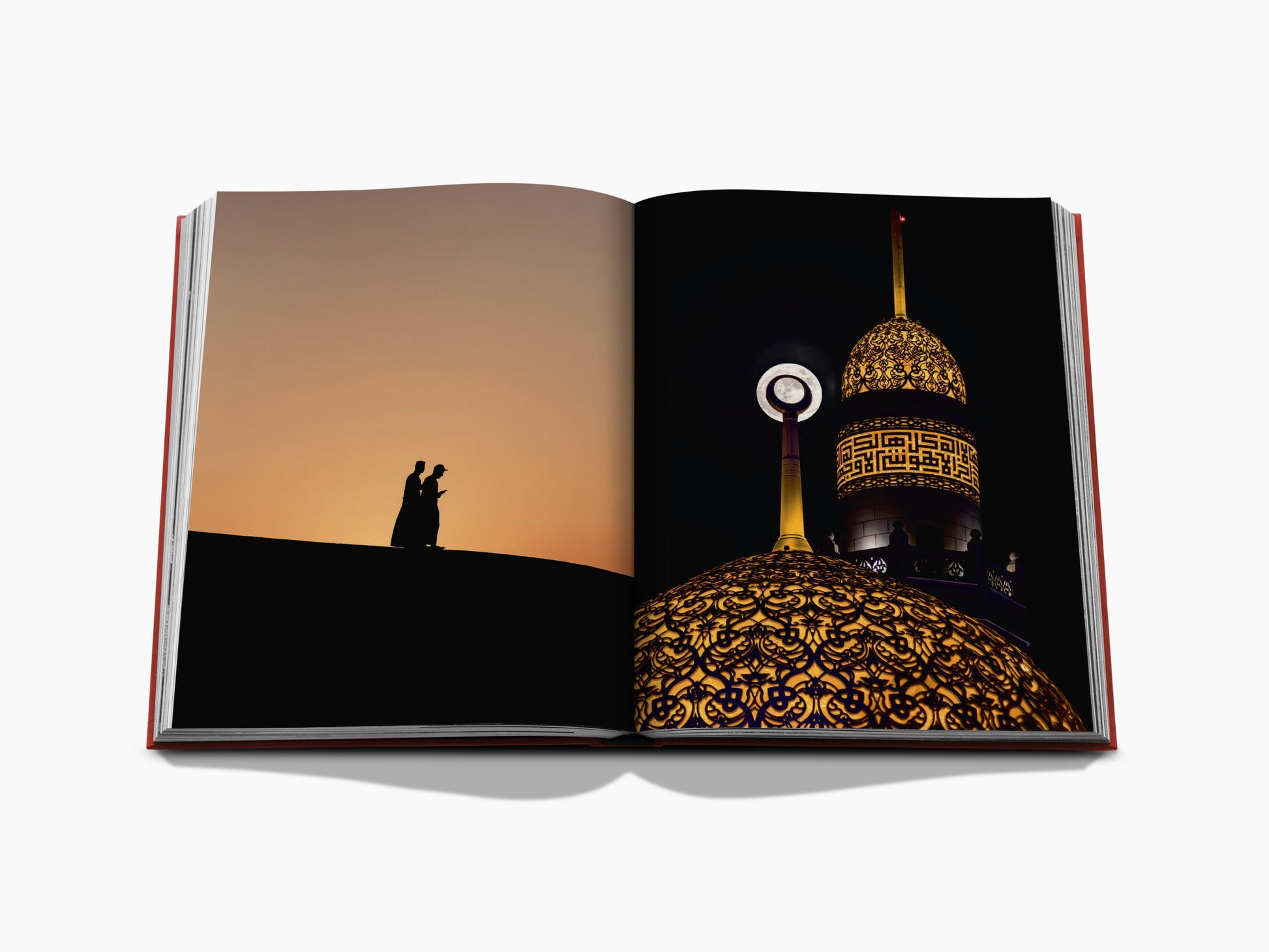 Two silhouettes walk across a dune at sunset on the left page, with a glowing ornate dome on the right page.