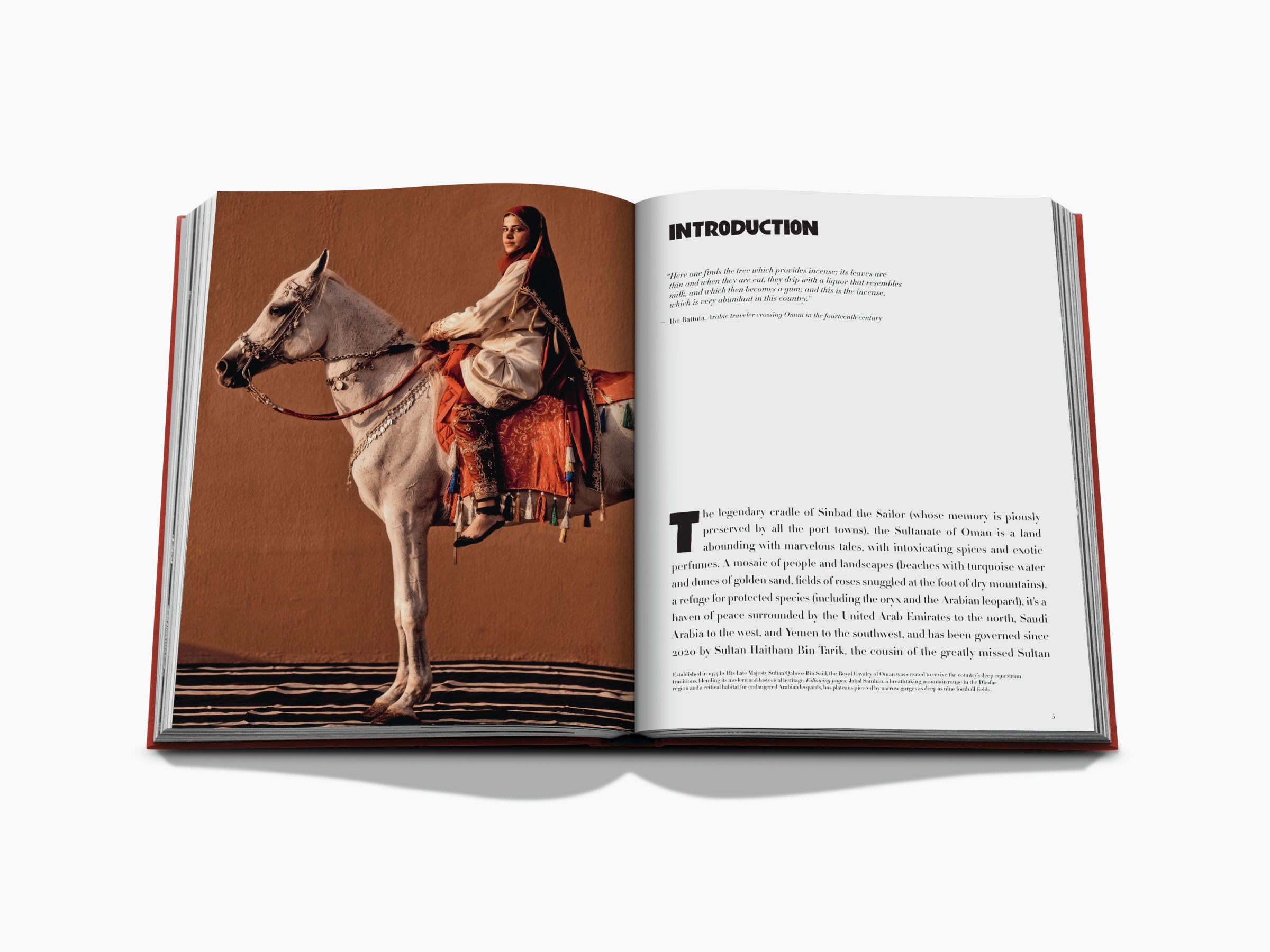 Desert scene with a rider on a white horse on the left page, and an introductory heading and paragraph on the right page.