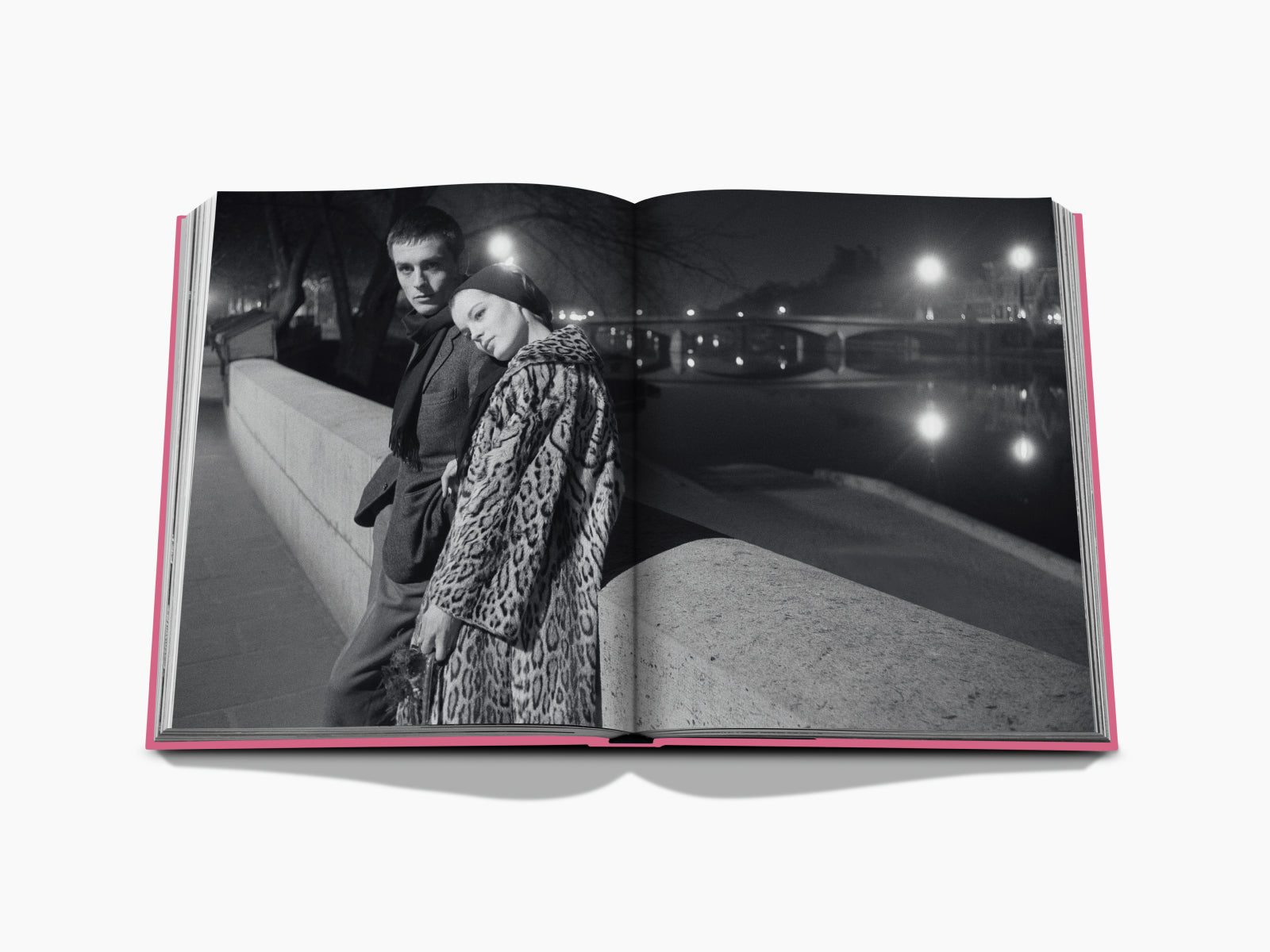 Paris by Paris spread depicting a couple leaning on a riverside wall at night on the left and a lit cityscape on the right.