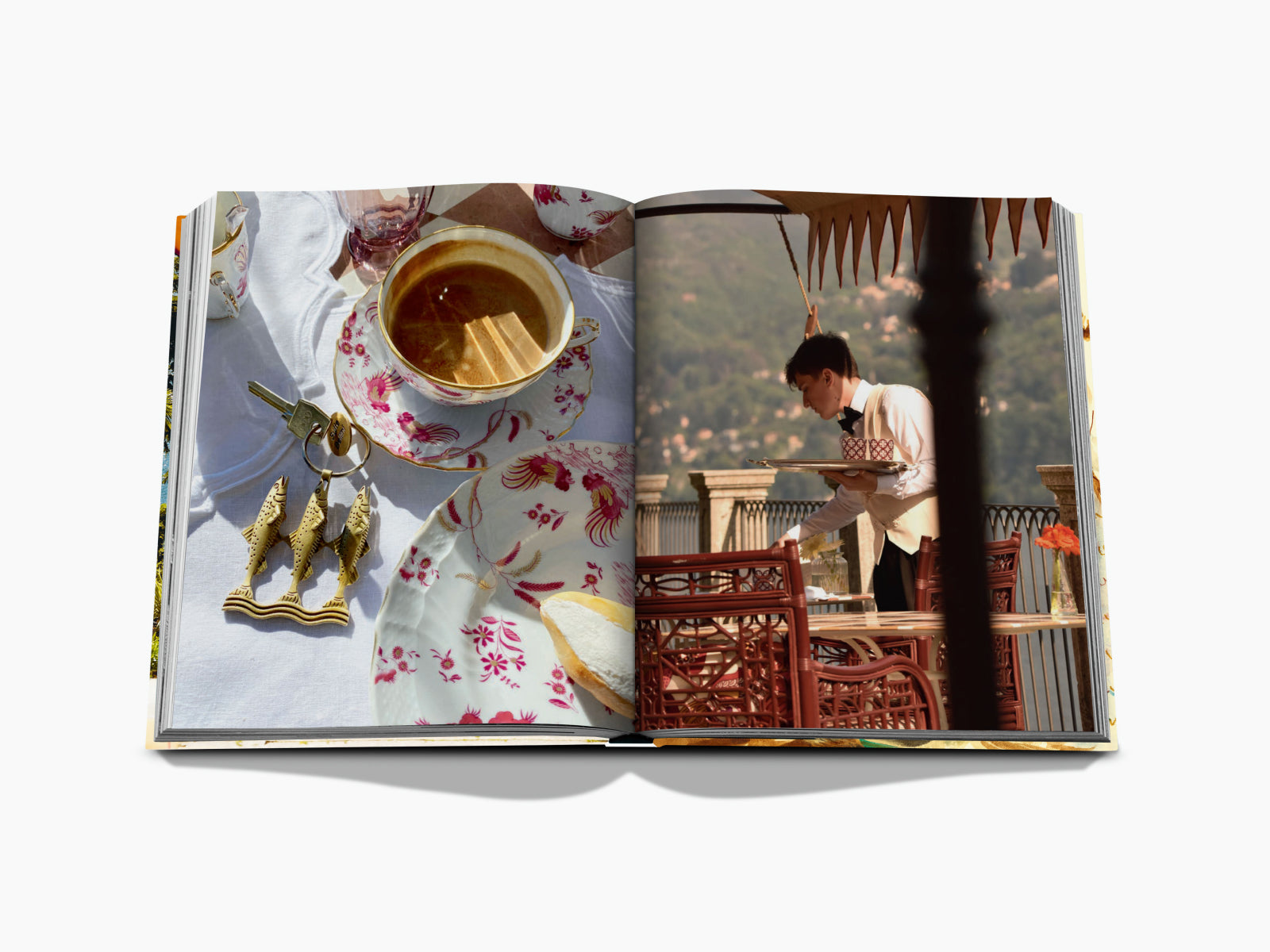 Open book spread with a floral painting on a black page left and a waiter carrying a tray of flowers ascending a stone staircase on the right.