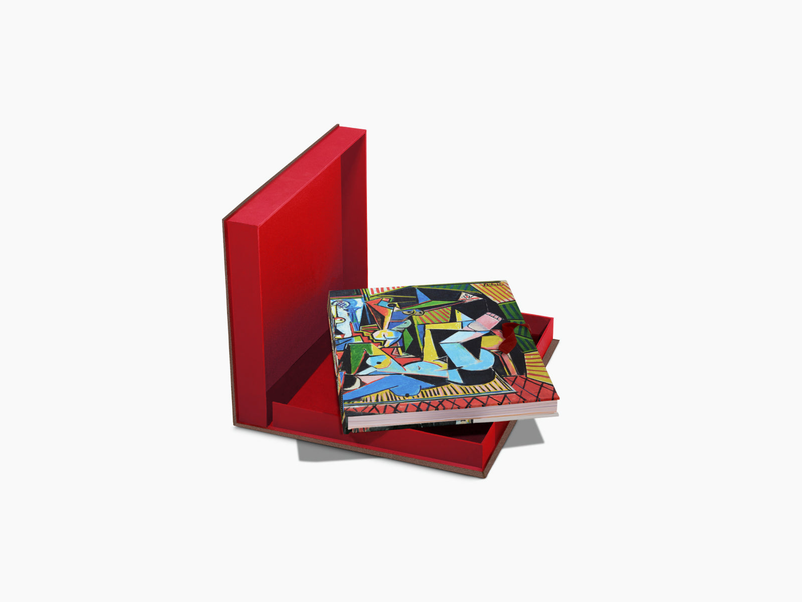 Open red box with a colorful Picasso The Impossible Collection book inside