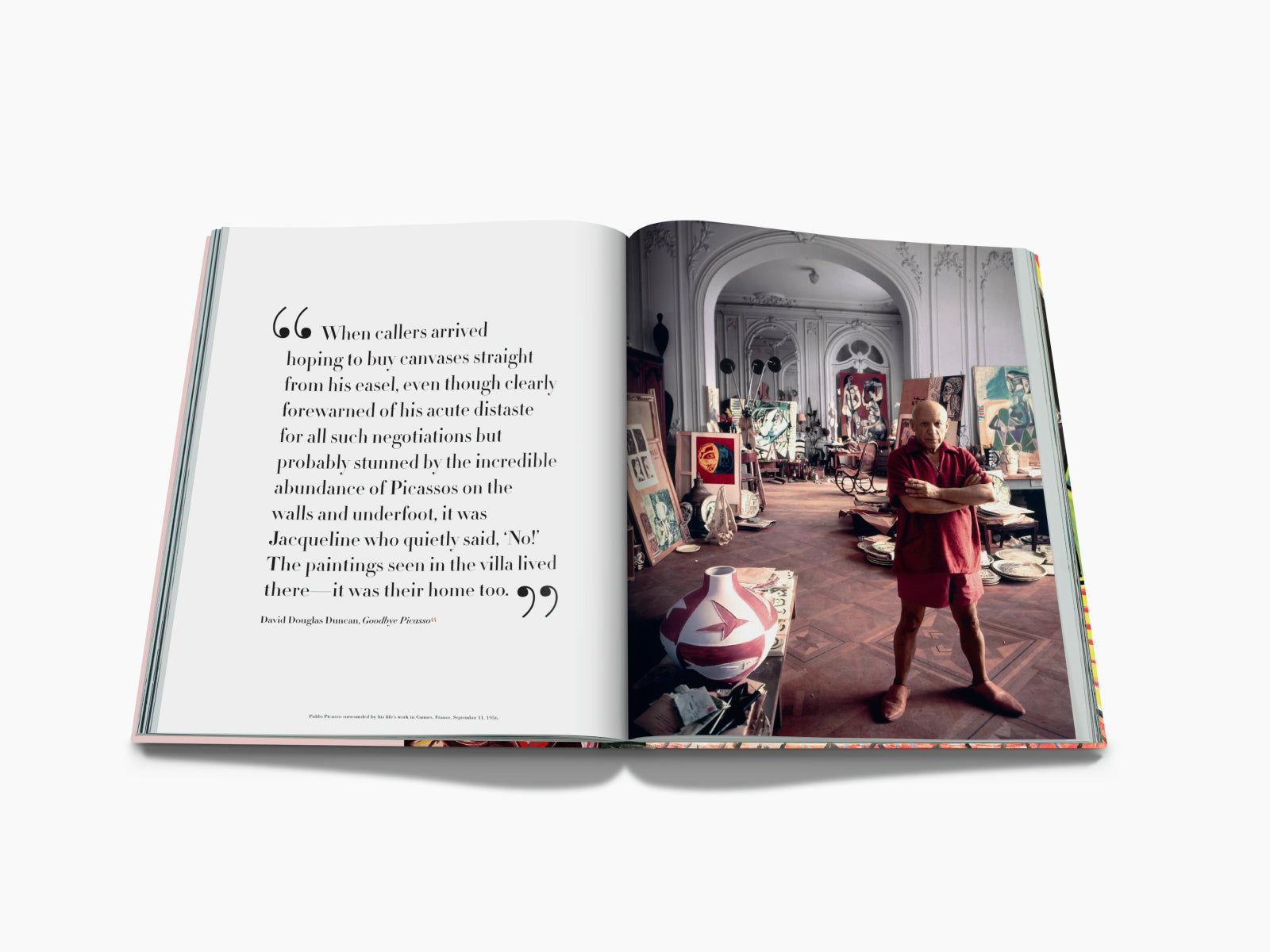 Open spread from Pablo Picasso The Impossible Collection with a left page quote and a studio filled with canvases on the right.