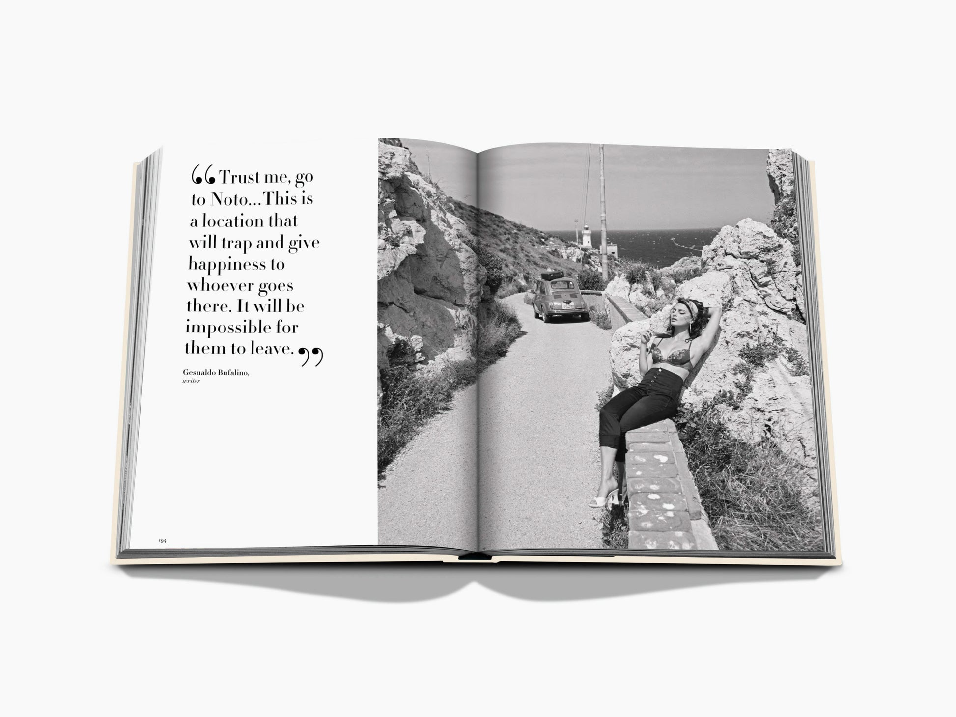 Open book spread with a large quotation on the left and a black and white coastal road scene featuring a woman and a vintage car on the right.