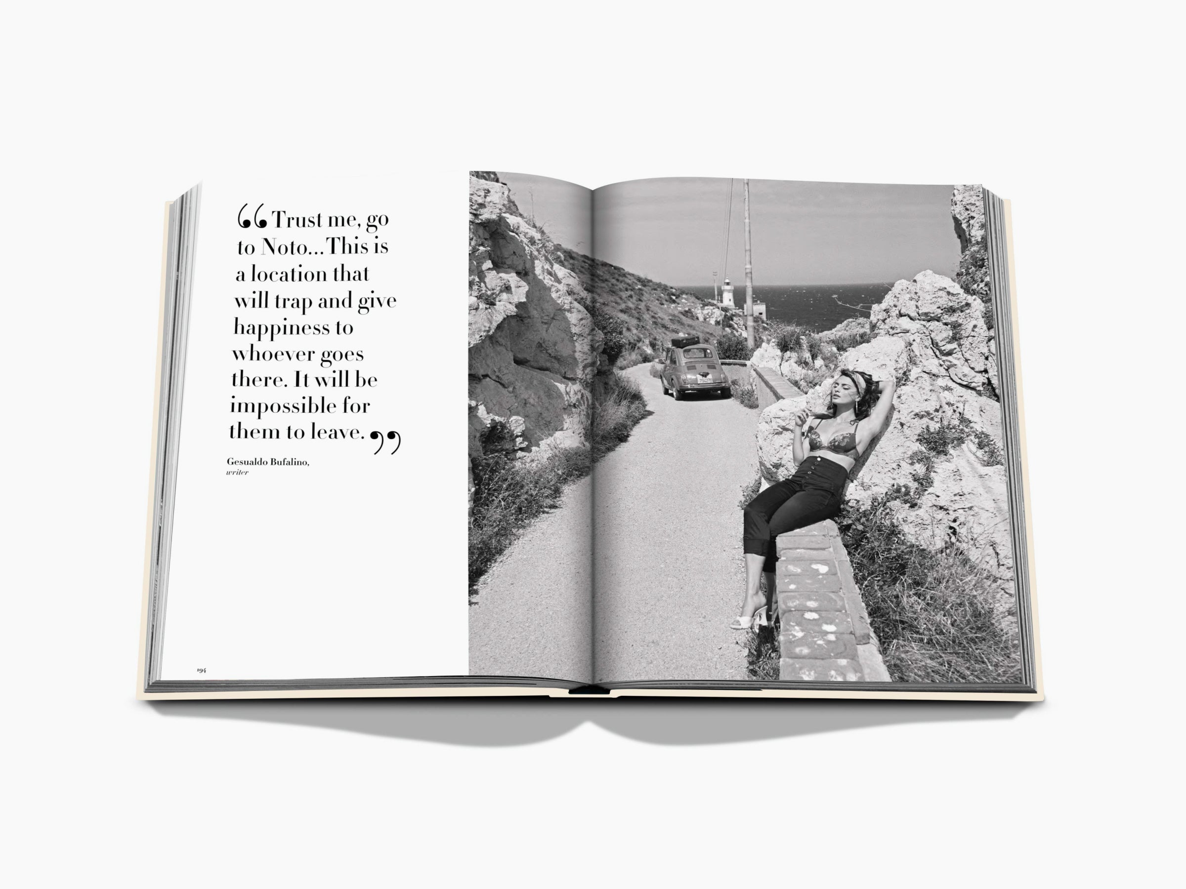 Open book spread with a large quotation on the left and a black and white coastal road scene featuring a woman and a vintage car on the right.