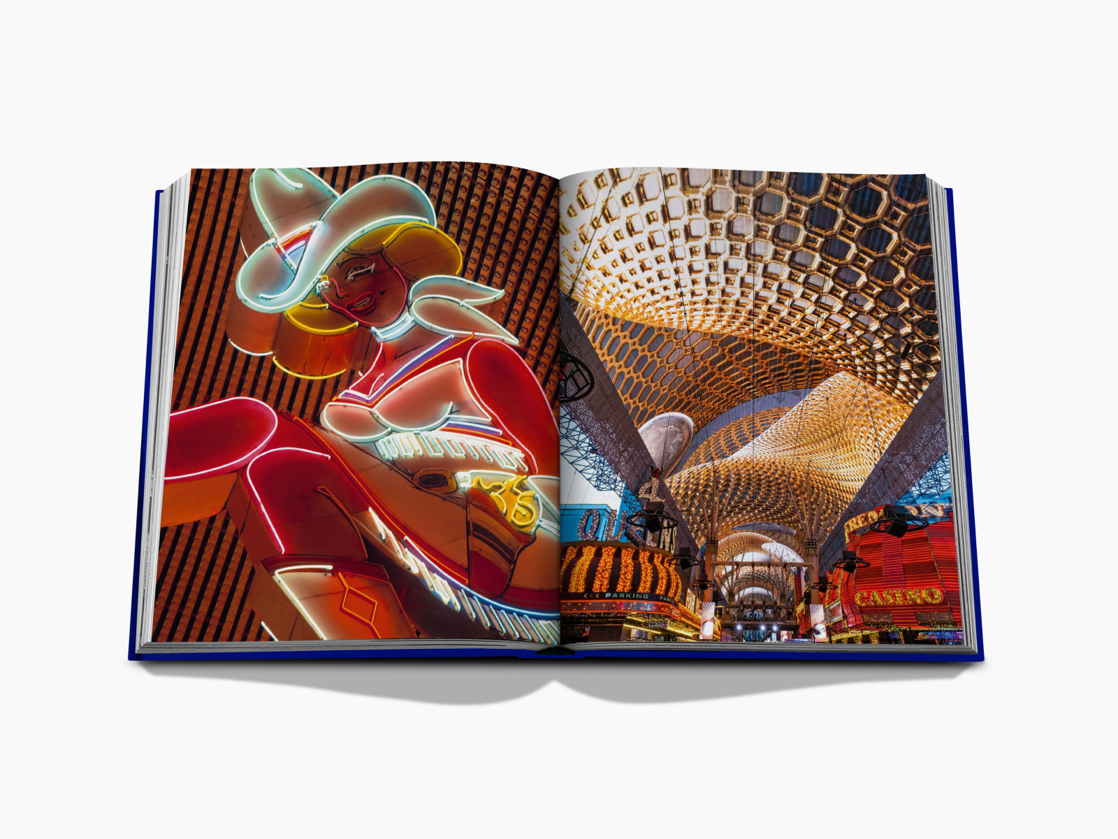Las Vegas neon showgirl sign on the left page with a futuristic honeycomb ceiling on the right.