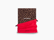 Leopard print Wild Thoughts notebook wrapped in a bright red fabric strap.
