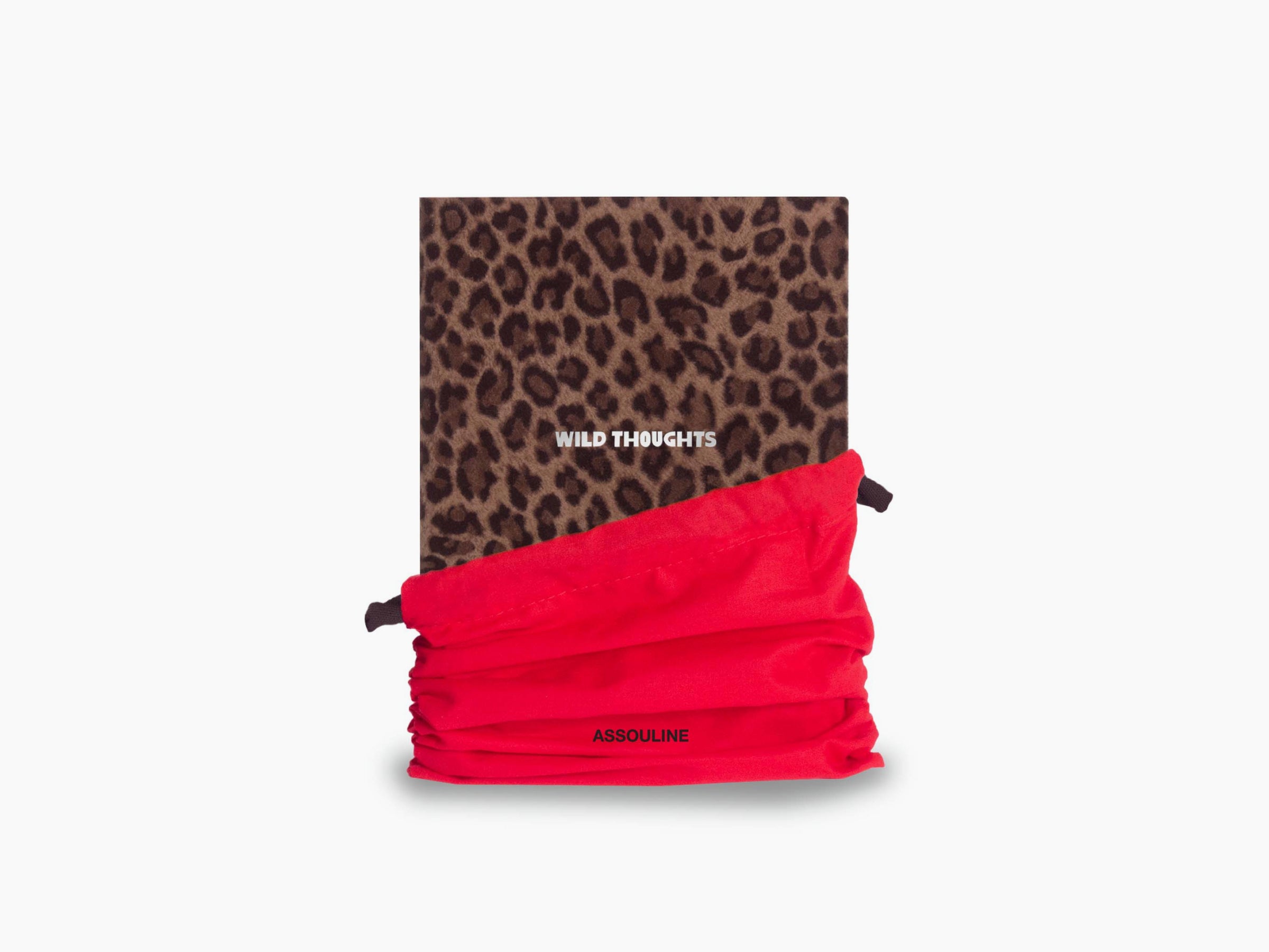 Leopard print Wild Thoughts notebook wrapped in a bright red fabric strap.
