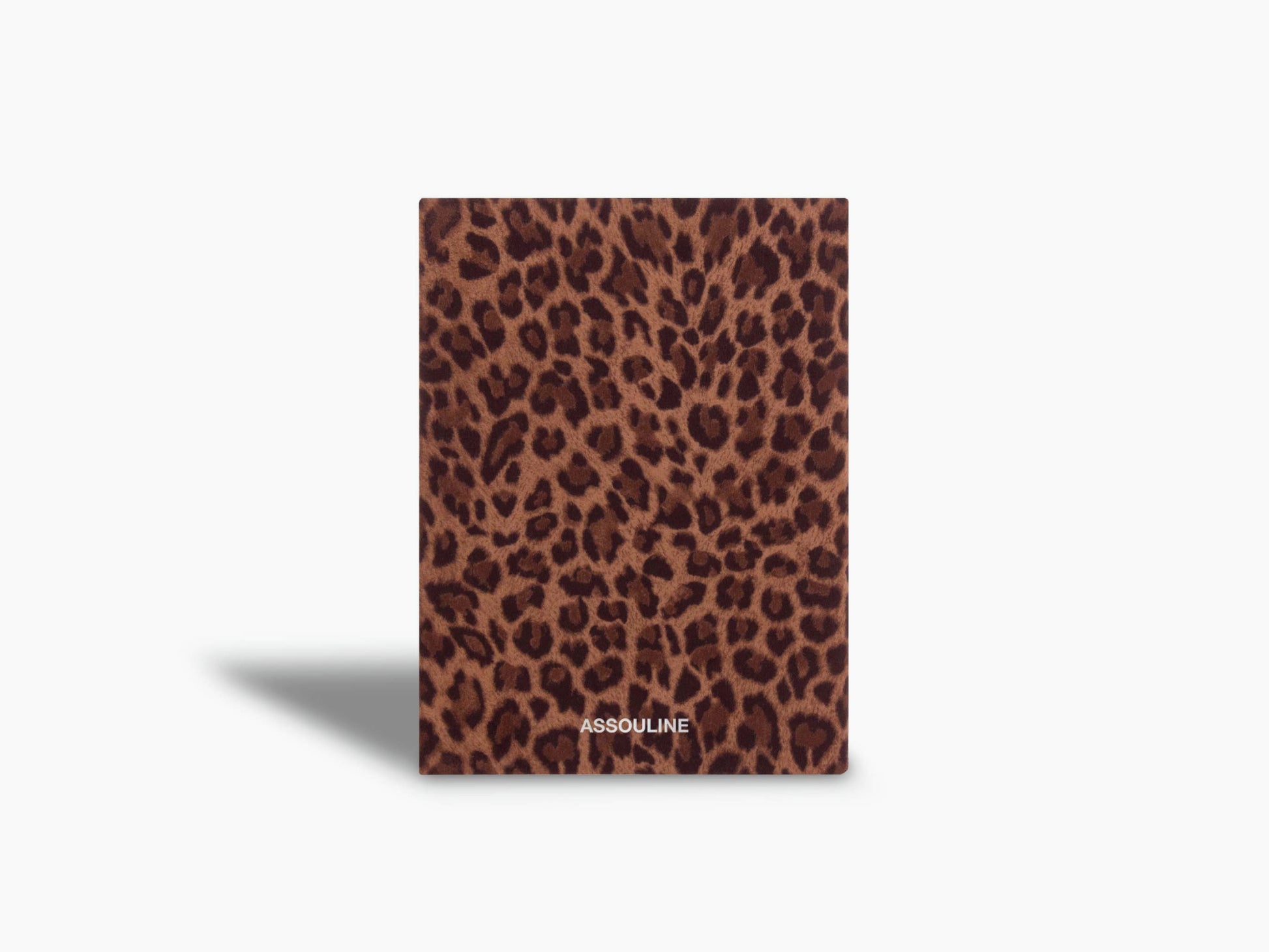 Leopard print Wild Thoughts notebook standing upright with the Assouline logo.