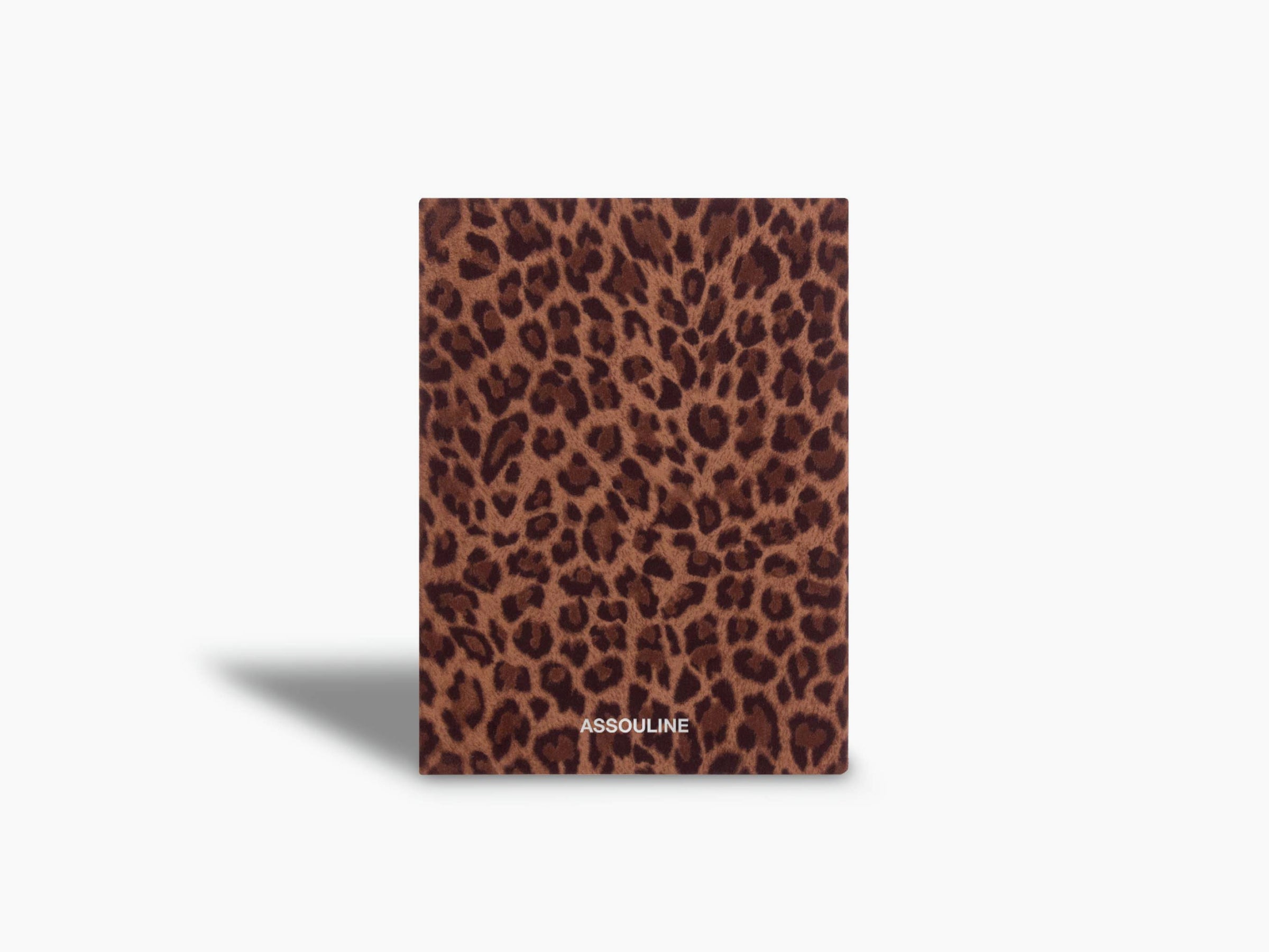 Leopard print Wild Thoughts notebook standing upright with the Assouline logo.